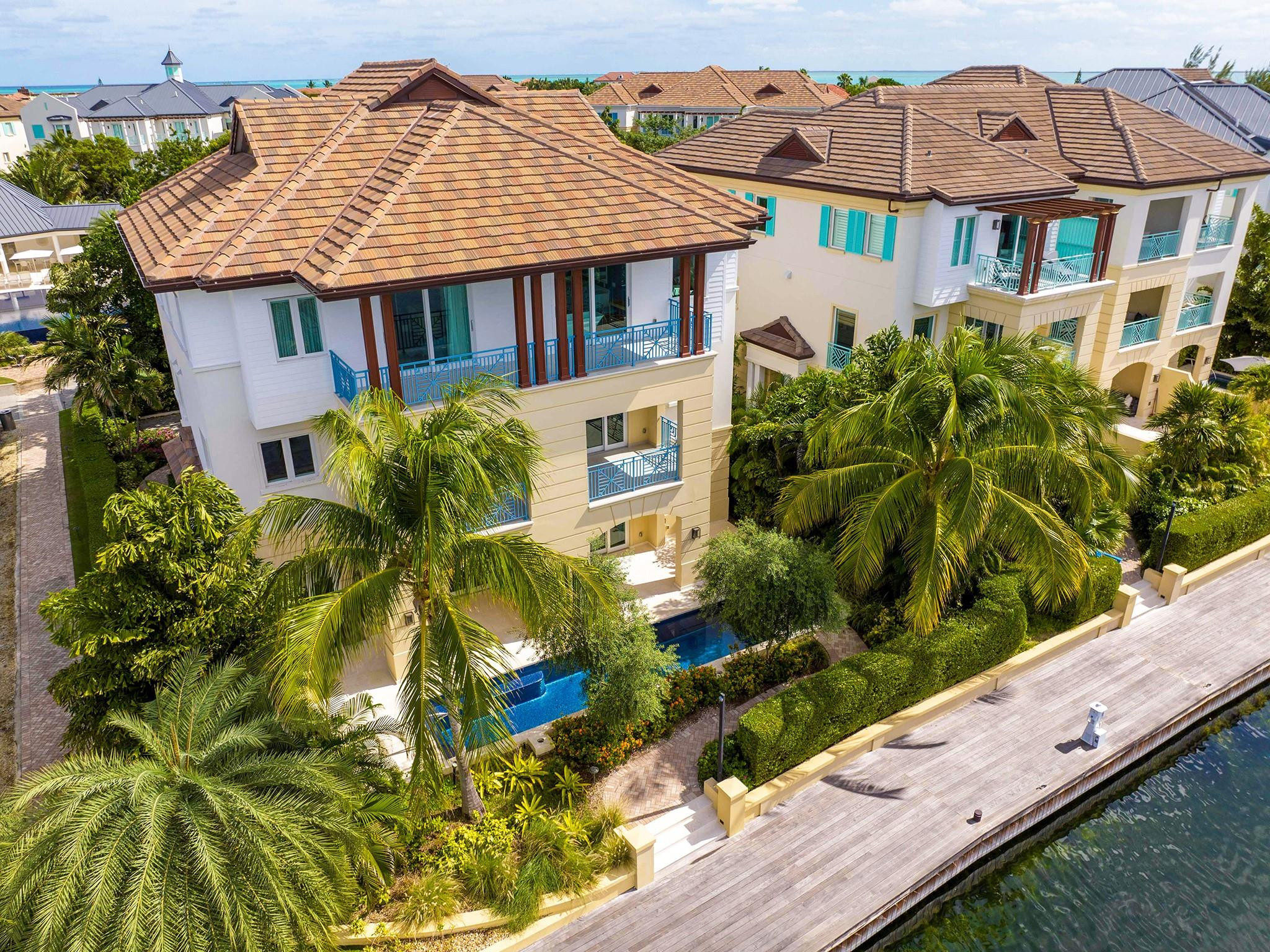 SOLD at Luxury AUCTION Without Reserve on Mar 7, 2024! List price for REFERENCE ONLY. Located in The Residences of Stone Island, a premier waterfront enclave on Grand Cayman, adjacent to the Cayman Islands Yacht Club and a short walk from Seven Mile Beach. Three living levels span 9,500 total sf, with 5 beds & 8.5 baths. Features include a gourmet kitchen, elevator, home theater, office, 2 garages and a pool with loggia and summer kitchen. Completed in 2020, never occupied and impeccably maintained. Conveys with $750,000 of unused furnishings included! Community amenities include gated entry, 24-hr security, private boat slips, waterfront boardwalk, playground, infinity pool and posh owners’ clubhouse. Do NOT call Listing Agent directly. For info, call Office Phone or 800 Number in listing... Buyer Brokers protected. Selling Without Reserve at Luxury AUCTION Mar 7, 2024! Refer to Luxury Auction Terms of Sale (avail. upon request). Current list price for REFERENCE ONLY. Convenient, Pre-Auction Previews held daily by appt. through Mar 6. Call to schedule.