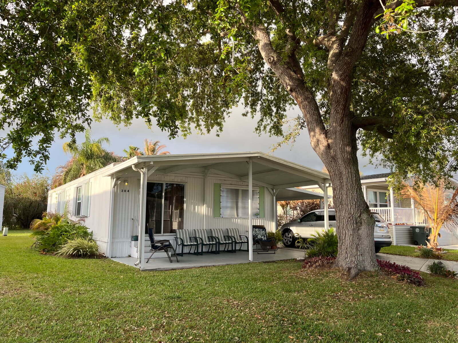 Manufacturer home that as ben remodeled and well taken care of. Painted, insulated,new carpet and 16' toliets. New washer that stays with the property. It has been powerwashed and a vapor barrier underneath. Ready to move in! Beautiful home! You won't be disappointed.