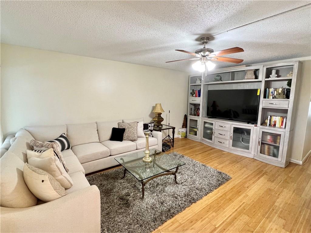 BEAUTIFUL LUXURY STYLE 2 BED 2 FULL BATH CONDO READY FOR ITS NEW OWNERS! FULLY FURNISHED, MOVE RIGHT IN! OPEN KITCHEN WITH WHITE CABINETRY, GRANITE COUNTERTOPS, STAINLESS STEEL APPLIANCES, RECESSED LIGHTING AND A DECORATIVE BACKSPLASH. GORGOUS WOOD FLOORS ADORN THE LIVING AND BEDROOM AREAS.  MASTER BATH HAS A SHOWER/TUB COMBO W/NEWER TILE AND GRANITE COUNTERTOP. SECOND BATHROOM HAS A FULL SIZE SHOWER STALL WITH UPDATED TILE AND ACCENTS. SIT BACK AND REALX AND ENJOY YOUR XLARGE BACK PATIO..YOU WILL LOVE IT HERE! CLOSE TO THE LARGEST POOL IN THE VILLAGE! CENTURY VILLAGE HAS RESORT STYLE AMENITIES TO INCLUDE A THEATER, INDOOR POOL AND OUTDOOR POOLS, FITNESS CTR, BILLIARDS, GAMEROOMS, PICKLEBALL, TENNIS, VOLLEYBALL, PUTTING GREEN, COURTESY SHUTTLE AND MORE! ASSOCIATION CLAIMS 55+