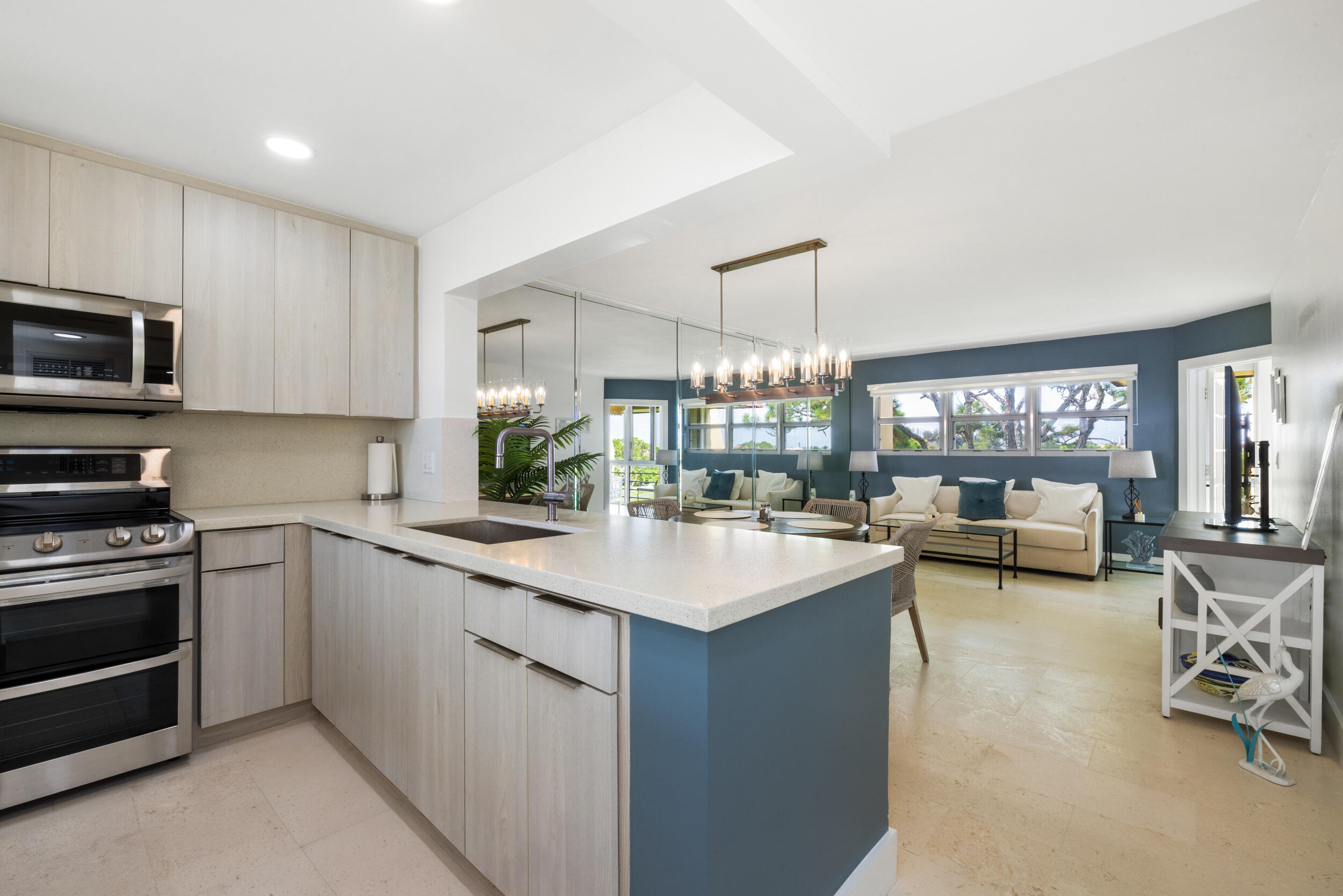 Welcome to the epitome of Florida condo living! This rare, fully renovated top-floor condo offers the perfect blend of modern luxury and comfort. With a bright, open layout and sweeping views of the golf course, it's an entertainer's dream. The living room, enhanced by impact-resistant windows, is bathed in natural light, creating a warm and inviting atmosphere. Step outside onto the cozy, private patio and enjoy breathtaking vistas of the lush golf course - the ideal spot for sipping your morning coffee or unwinding at sunset. Convenience is at your doorstep, with an elevator just steps away for easy access. Across the street, you'll find a sparkling pool and a clubhouse offering everything you need for relaxation and recreation.