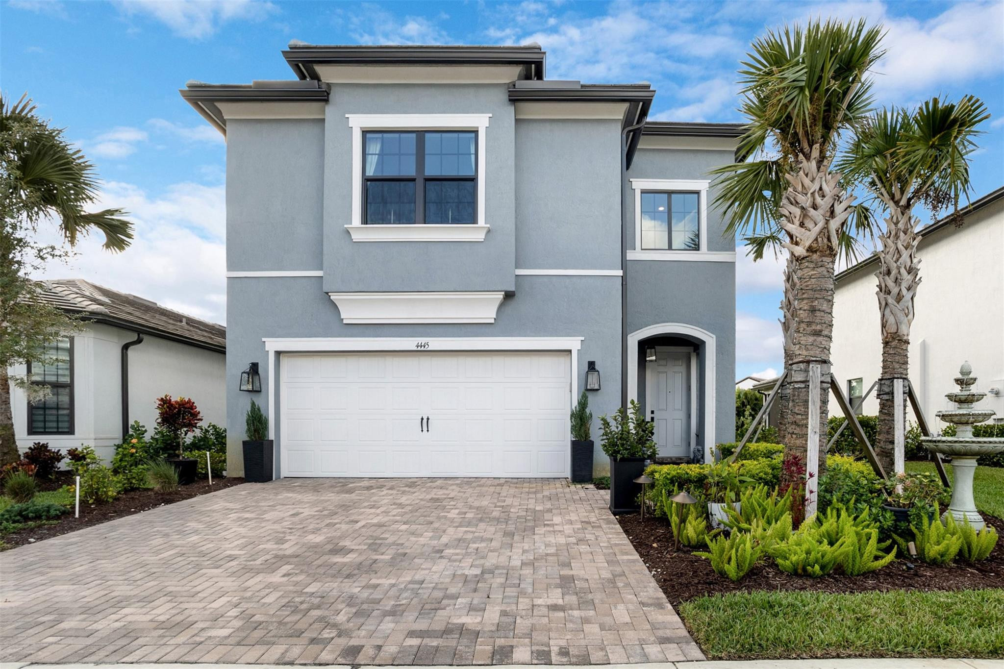 Enjoy resort-style living in Oak Tree, a premier gated community. Built in 2023, this 3-bedroom, 2.5-bath home includes a two-car garage and modern finishes. The kitchen features quartz counters, wall oven, gas range, and an island that opens to the living area. A dining room with backyard views connects to the screened patio. The first floor offers a flex office with French doors, while upstairs a den separates the bedrooms.The primary suite boasts a tray ceiling, walk-in closet, and spa-style bath with oversized shower. Built to current codes with impact glass, high ceilings, new roof, and appliances under warranty. Community amenities include a clubhouse, pickleball courts, barefoot bar, resort-style pool with cabanas, BBQs, fire pits, fitness center, dog park, and more.