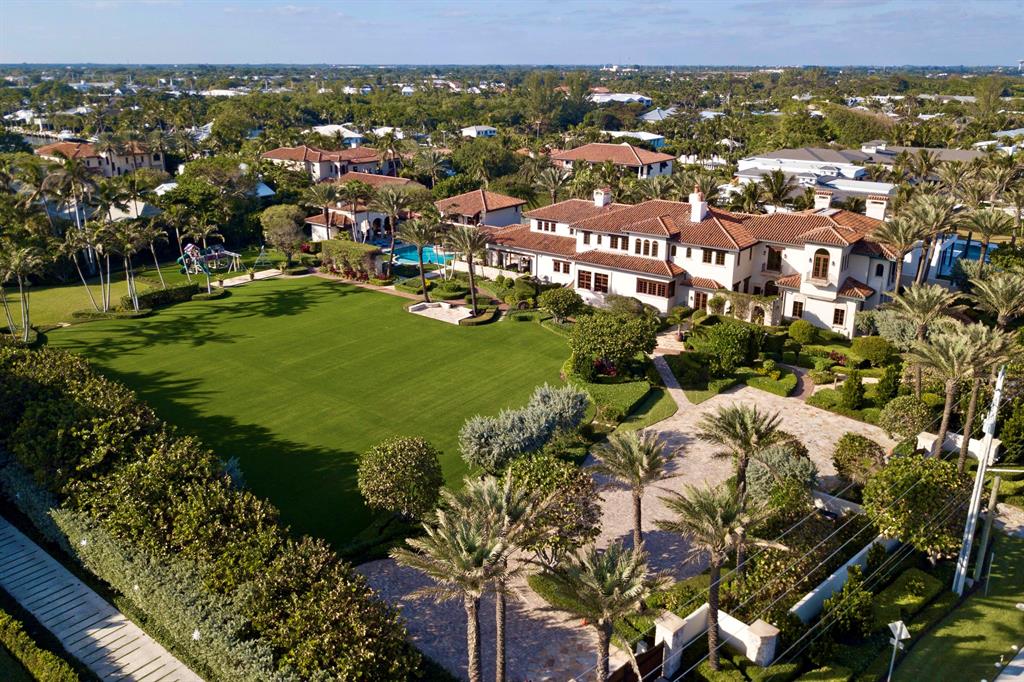 An incomparable mode of private beach living awaits in this all-encompassing glorious Mediterranean Revival estate by the sea. This expansive property forms one of the largest remaining estates in Delray Beach, now totaling 2.767 acres, with 308 feet of frontage across from the Atlantic Ocean. Courchene Development Corporation, Dailey Janssen Architects and Marc-Michaels Interior Designs collaborated to create the sublime beauty that is this masterful estate. Great care was taken to integrate authentic Old World elements with contemporary luxuries throughout the sophisticated interior. This residence is exquisitely finished with antiqued European oak, mahogany, Pecky cypress, limestone, coral, and Alhambra tile. The main house and guest apartment consist of more than 26,000 total sq ft An incomparable mode of private beach living awaits in this all-encompassing glorious Mediterranean Revival estate by the sea. This expansive property forms one of the largest remaining estates in Delray Beach, now totaling 2.767 acres, with 308 feet of frontage across from the Atlantic Ocean. Courchene 
The estate features 8 bedrooms, 9 full baths, 3½ baths, 7 fireplaces, full sized elevator, bespoke kitchen with walk in fridge, , gaming room, multiple family rooms, relaxation spa, massive fitness center, 10+ car garage, numerous covered loggias, large turf field, several lush gardens, walking paths, recreational fields, and entertaining areas - all with views of the ocean, saltwater pool or gardens. Conveniently located just blocks from the famed Atlantic Ave of Delray Beach, this one-of-a-kind estate offers the privacy of a secluded compound with proximity to all the wonderful activities that are Delray Beach. Recent upgrades include: New Hurricane impact window and doors, woodwork, HVAC, landscaping, drive, gates, electrical systems, and many more other improvements. **More information available upon request**