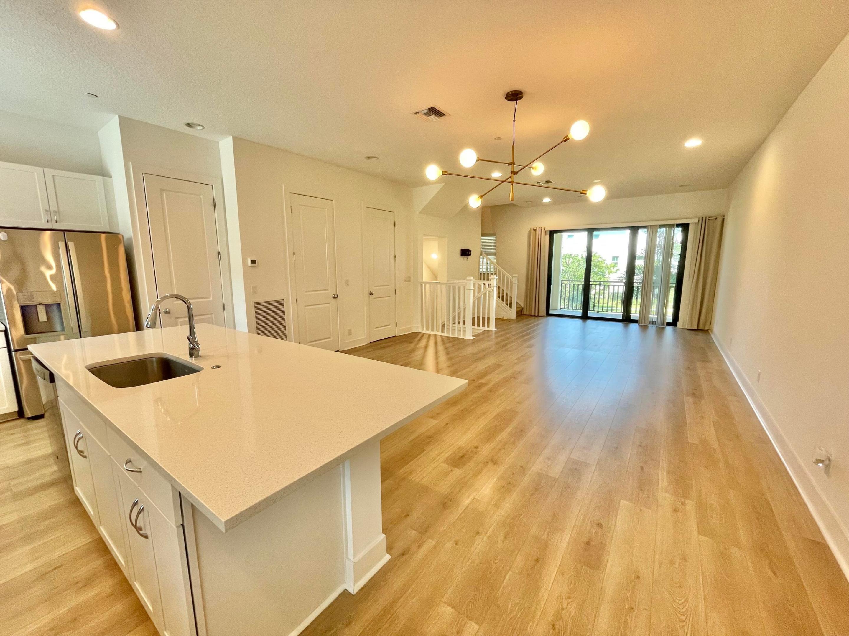 Experience refined modern living in this newly constructed and impeccably designed three-story townhome in the highly sought-after Alton community. This elegant residence features 3 spacious bedrooms, a private office/den, 3.5 luxurious bathrooms, and a 2-car garage, offered unfurnished for an annual lease. Residents enjoy access to Alton's exceptional resort-style amenities, including a sparkling pool, state-of-the-art fitness center, cabanas, beach volleyball courts, tennis facilities, playgrounds, and a dog park—all included as part of the community lifestyle. Ideally situated at 12666 Machiavelli Way, this home is just moments from the premier shopping and dining of Alton Town Center, with convenient access to I-95, Abacoa, pristine beaches, and all that PBG and Jupiter have to offer.
