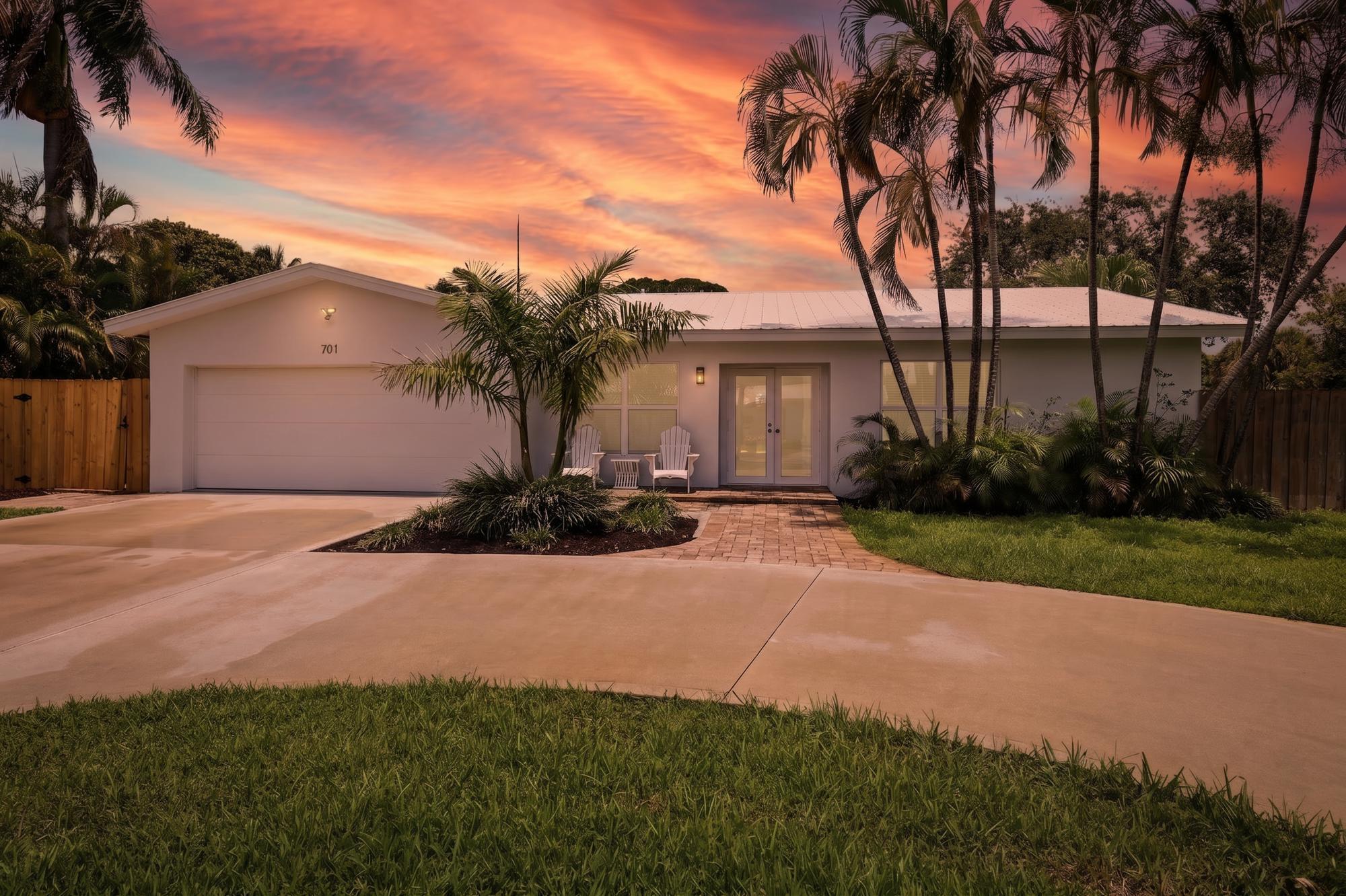 Tucked into a convenient Boynton Beach location just minutes from Atlantic Avenue in Downtown Delray, the beach, I-95, and nearby hospital access, this home delivers the lifestyle buyers are searching for: coastal convenience, everyday comfort, and room for all the toys. From the moment you arrive, the curb appeal feels fresh, bright, and unmistakably Florida with a crisp white exterior, tropical landscaping, a spacious driveway, and a two-car garage. Inside, the home features an open, easy-living layout with tile flooring, a generous kitchen, warm wood cabinetry, granite countertops, stainless steel appliances, and plenty of storage. The backyard is where this property truly shines. A private fenced yard, oversized paver patio, covered outdoor living space, and sparkling pool create  the perfect setup for slow mornings, weekend BBQs, and long South Florida afternoons outside. Plus, the side yard offers rare space with potential to park a 35-foot boat, possibly larger depending on configuration. Whether you want quick access to Delray's restaurants and nightlife, beach days within minutes, an easy commute via I-95, or a home with room to spread out, 701 SW 27th Place brings it all together.