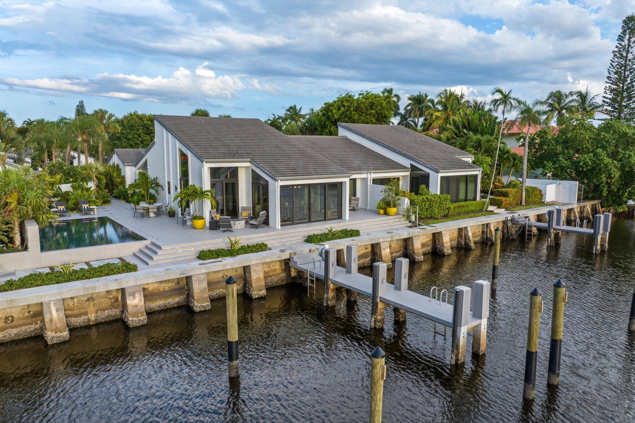 Private Waterfront Villa with Protected Preserve Views.
Experience unparalleled coastal living in this reimagined waterfront villa, where elegance and tranquility meet. Perfectly positioned along a wide waterfront with protected views of a stunning nature preserve and the Intracoastal, this residence offers both privacy and beauty in a coveted location.
Step inside to expansive living spaces filled with natural light and endless water views from nearly every room. The gourmet kitchen showcases custom white oak cabinetry, top-of-the-line appliances, and hardwood flooring, seamlessly designed for both entertaining and everyday living.
Accommodations include a luxurious master suite with spa-inspired bath and custom closets, a VIP suite with en-suite bath, and a spacious guest bedroom, each designed with comfort, privacy, and water vistas in mind.
Outdoors, indulge in the ultimate boating lifestyle with two private slips accommodating vessels up to 60 feet, a newly extended dock, and quick access to the Inlet. Relax by the pool, entertain on sunlit terraces, and enjoy direct access to one of the area's best beaches, just a short walk away.
A rare offering, this villa blends refined design with the very best of waterfront living 
HIGHLIGHT
*Pelican Cove waterfront villa -completely renovated and redesigned inside and out 2023-2024
*3 bedrooms / 3 full baths 
* 2,821 square feet under air / 3,393 total square feet(
* 2 car air conditioned garage 
*Full house generator
* New Extended  Dock  with 2 slips can accommodate up to two 60-foot boats; power and water at dock; nearby inlet for ocean access(
* Gated entry (unmanned); onsite manager; and clubhouse with pool, kitchen and fitness room
* Beach access across A1A 
*Lease permitted 1 time per year
*Up to 2 pets permitted 
*Newly installed hurricane impact doors and windows 
*New HVAC
*All plumbing and electrical fully updated
*Infinity pool, heated, saline 
*Lush Professional landscaping with native palms and exotic species plants black river pebble accents
*Porcelain patio and walkways
*Savant fully programmable whole house automation with integrated touch screens.  
*Lutron fully programmable lighting and illuminated custom bronze switch plates. 
*Lutron shades throughout with upgraded bronze hardware and drapery controls
*Flooring premium white oak 10" wide plank 
*Appliances Wolf, Sub Zero, Cove
*Custom White Oak cabinets by Everwood with premium hinges and soft touch glides. Matte Black cut in finger pull hardware. 
*Bar with Beverage Fridge, Icemaker 
*Laundry Room / Pantry includes 200 bottle SubZero wine cooler