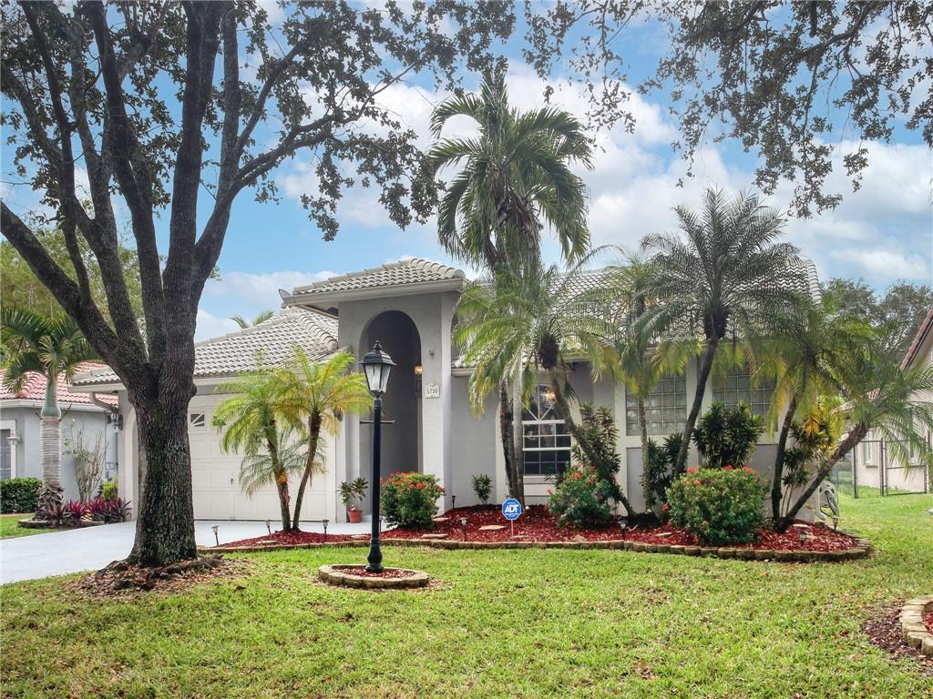 LOCATION LOCATION LOCATION!!! SPACIOUS FOUR BEDROOM LOCATED IN THE ARBORS OF CORAL CREEK. KITCHEN FEATURING RICH GRANITE AND STAINLESS APPLIANCES. FABULOUS SPLIT FLOOR PLAN BOASTS LARGE OWNERS SUITE, INTERIOR UTILITY ROOM, RELAX ON YOUR BACK PATIO OVERLOOKING YOUR BACKYARD LINED WITH BANANA TREES! RIDE YOUR BIKE TO CORAL SPRINGS SCHOOLS! CONVENIENTLY LOCATED NEAR PROMENADE, SAWGRASS, RESTAURANTS, & MAJOR HIGHWAYS. LOW HOA FEES!