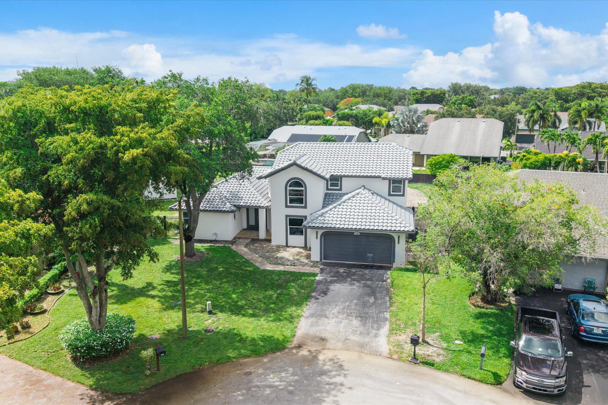 Exceptional opportunity to own one of the largest properties in desirable Winston Park! Situated on an oversized 15,858 SF lot, this spacious two-story home offers 4 bedrooms, 3 bathrooms, and an open-concept floor plan featuring soaring ceilings, a generous living area, and a kitchen that opens seamlessly to the family room, ideal for entertaining and everyday living. This property presents tremendous value and potential for a buyer with vision to restore it to its full glory. Features include hurricane-impact windows and doors throughout, a spacious primary suite with vaulted ceilings and dual-vanity bath, abundant kitchen cabinetry and storage, and a large private backyard with swimming pool.  A separate cottage with its own full bath and kitchenette provides added flexibility for guests, extended family, home office, or income-producing possibilities. Winston Park is a well-maintained community known for its attractive homes and exceptionally low HOA fee of just $250 per quarter. Property is being offered as a short sale and is priced accordingly to reflect needed updates and improvements.