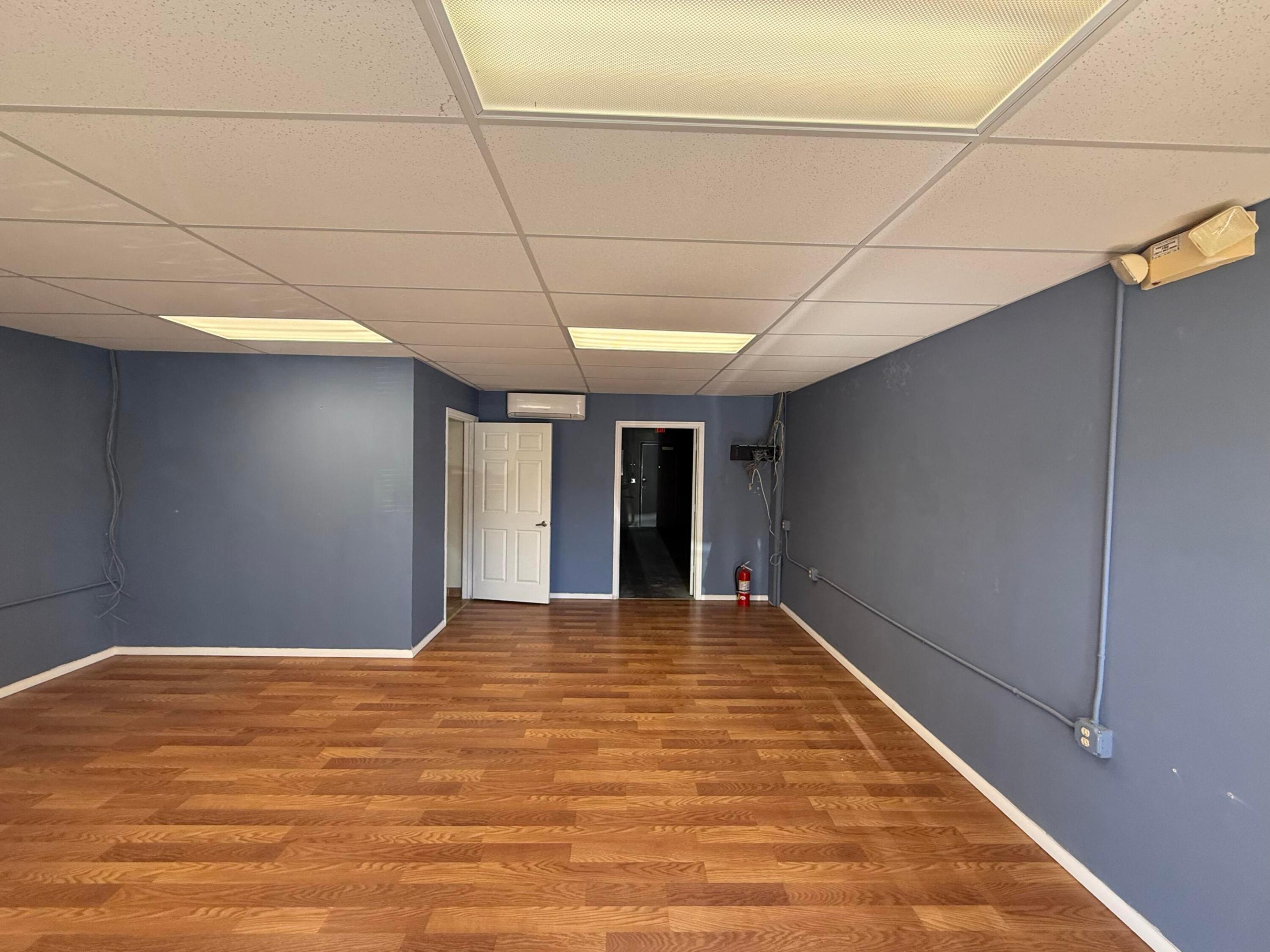 Ready? , This warehouse in a Gated industrial Park  is very unique, very versatile, 14 feet tall garage door! in the back, the entrance looks very professional, 1/2 bath, in the Warehouse, and there is an office on the second floor, again, 1/2 bath! and Elevator access!   , well kept development! Your Clients will be Impressed. There is even a car wash for the Clients .Long lease ok...Water and sewer included. OWNER INCENTIVE : ONE FREE MONTH WITHIN THE FIRST YEAR