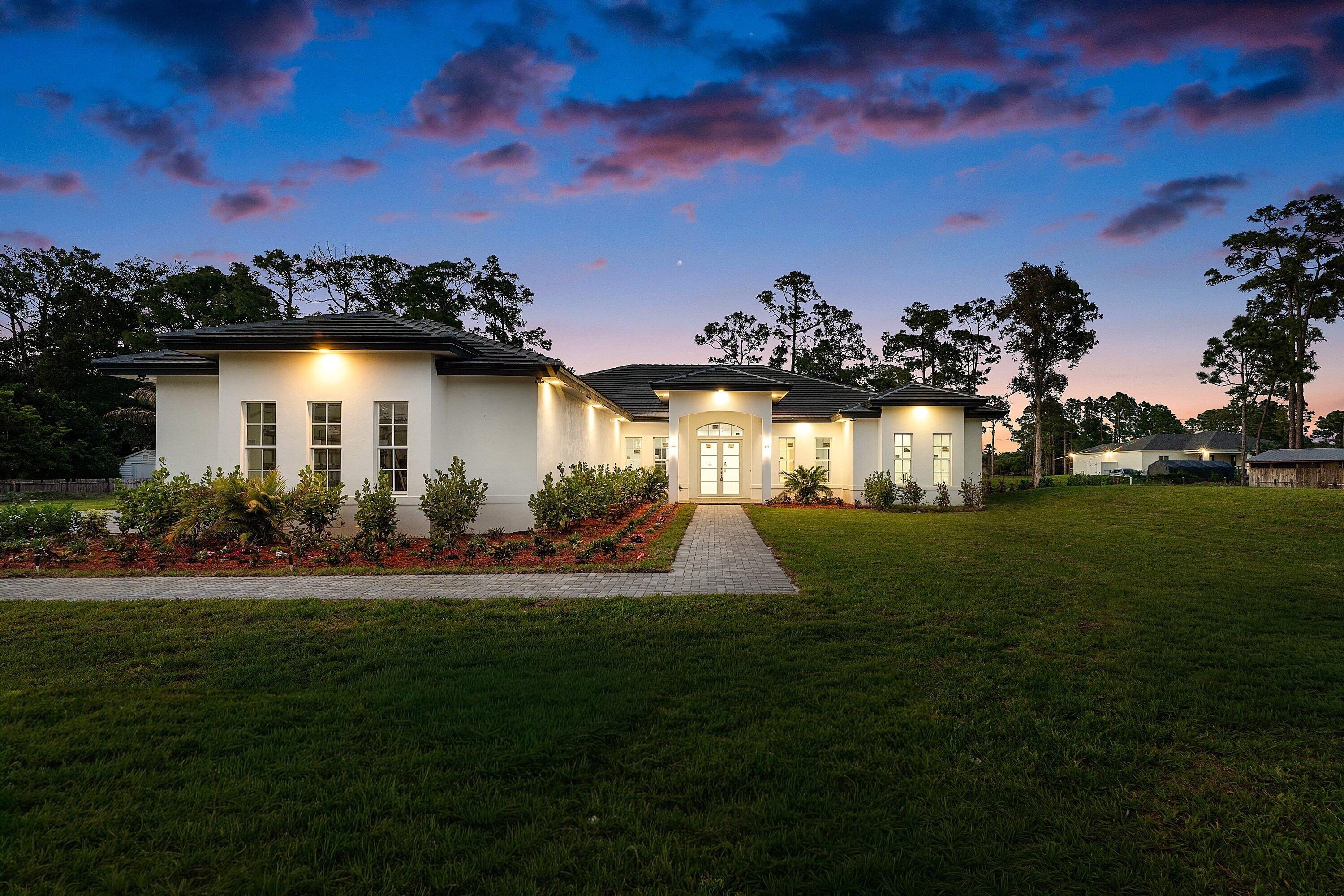 Brand new construction on a spacious lot in The Acreage with no HOA. This CBS home features a bright open floor plan, high ceilings, and modern finishes throughout. Kitchen opens to main living area, ideal for everyday living and entertaining. Split bedroom layout offers privacy, with a well-appointed primary suite featuring dual vanities and a large walk-in shower. Expansive covered patio runs the full width of the home, creating a true indoor/outdoor living space. Plenty of room for a pool, guest house, or both!