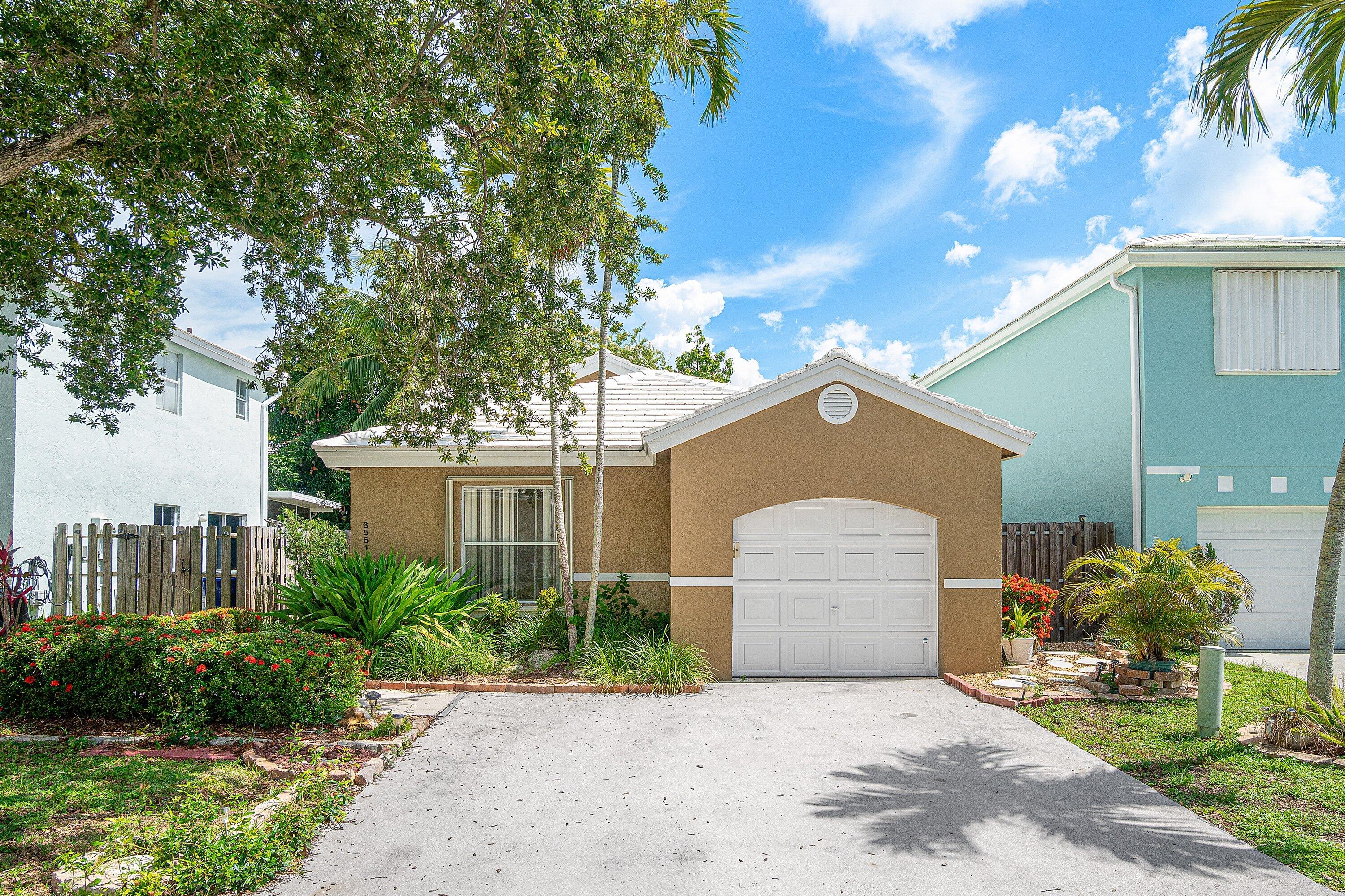 Beautiful 2 bedroom 2 bathroom single family home featuring an attached garage and located in the highly desirable gated Coral Bay community. This well-maintained split-bedroom floor plan features a newer roof 2014 and an updated kitchen with quartz countertops, a new range, and abundant cabinet space. Step outside to a low maintenance fully fenced backyard, perfect for relaxing, grilling, or entertaining. Accordion shutters provide added storm protection and peace of mind. Coral Bay offers outstanding amenities, including three community pools, tennis courts, basketball courts, playgrounds, and more. Conveniently located near shopping, dining, top-rated schools, and major highways. Low HOA fees and investor friendly.
