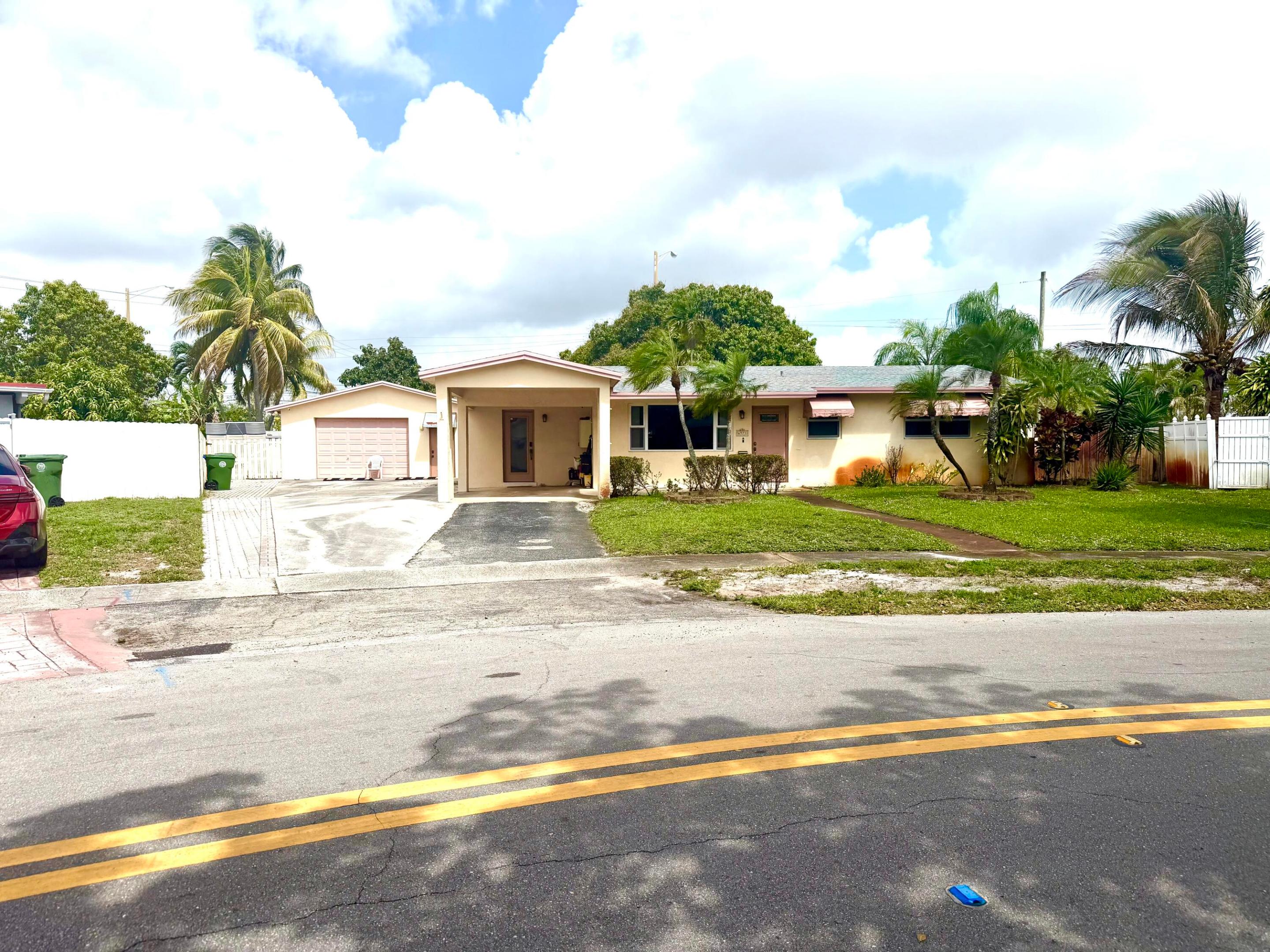 Beautiful Single family home Plus one bedroom one bathroom kitchen dining room living room separate apartment. Great investor opportunity with strong rental income: main house can be leased for $3500/month and separate apartment can be rented for $1600/month, for a total rental income of $5100/month, located on a quiet residential street, well maintained with upgraded kitchen includes granite counters, stainless steel appliances, Bathrooms remodeled. Floors wood laminate. Roof is five years old, windows all hurricane impact and doors. Very nice Porch with barbecue, large back yard for entertaining, enough space to install a pool with beautiful trees. detached garage was converted into a one bedroom one bathroom apartment with kitchen, can be rented for 1500 to 1600/ month.