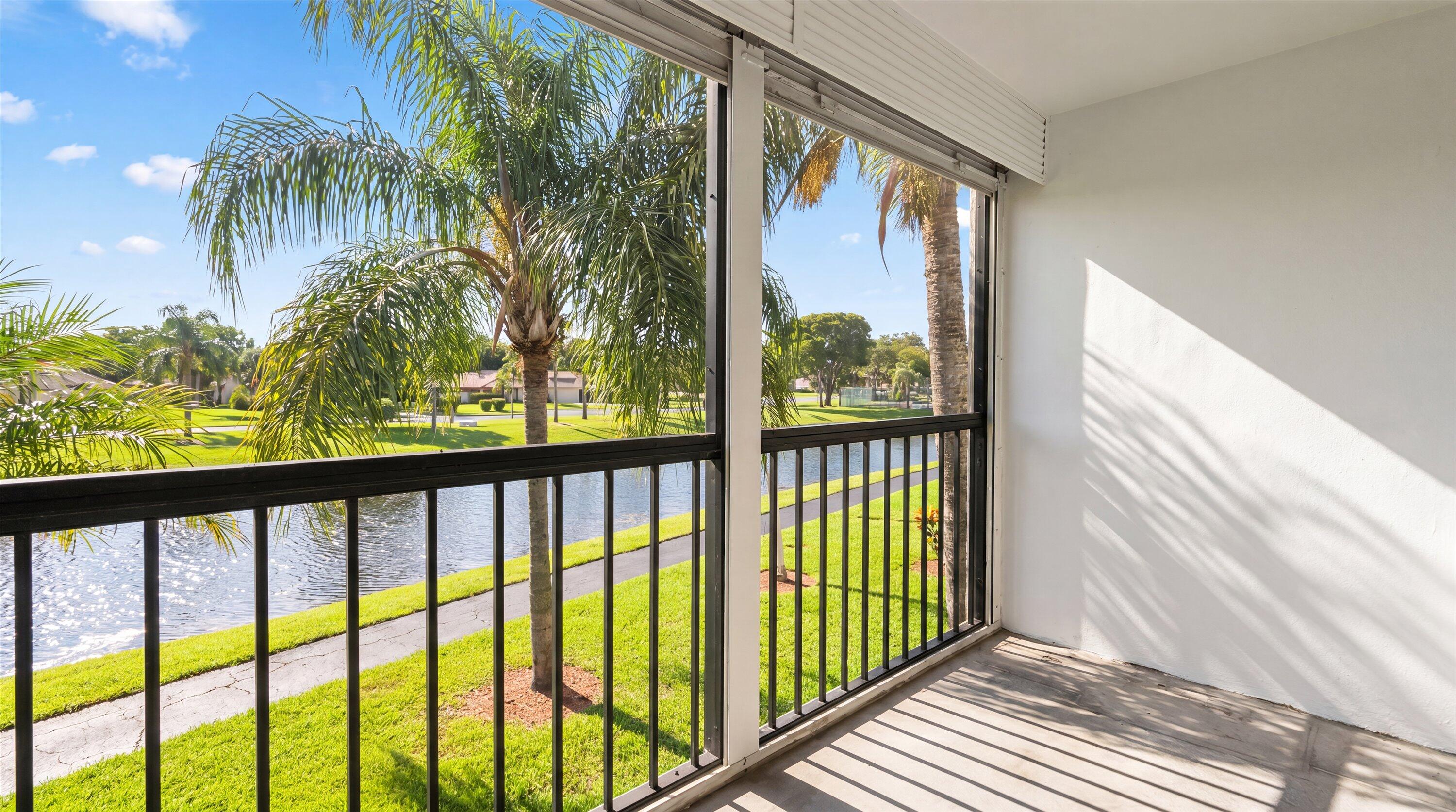Welcome to 1113 Green Pine Boulevard #C2, a beautifully renovated lakefront residence offering the perfect blend of style, comfort, and convenience in the heart of West Palm Beach. This completely remodeled second-floor condo has been thoughtfully updated from top to bottom, featuring a modern designer-inspired interior and brand-new appliances that make this home truly move-in ready.  Wake up to peaceful lake views and enjoy the privacy and tranquility of an elevated setting overlooking the water. The spacious layout is complemented by abundant natural light, creating a bright and inviting atmosphere throughout. Every detail has been carefully considered, allowing you to simply unpack and enjoy the Florida lifestyle.  Ideally situated within the community, this residence is conveniently  this residence is conveniently located near the residents-only private gate, providing quick and easy access in and out of the neighborhood. The gated Palm Club community offers a scenic setting with beautiful waterways and recreational amenities, creating a resort-like environment for homeowners.  Location is everything, and this home delivers. Centrally positioned in West Palm Beach, you'll be just minutes from I-95, Palm Beach International Airport, the Palm Beach Outlets, downtown West Palm Beach, the vibrant dining and entertainment districts, and the world-famous beaches and shopping of Palm Beach Island. The area continues to thrive as one of South Florida's most desirable destinations, offering an exceptional combination of convenience, lifestyle, and value.  Whether you're searching for a year-round residence, seasonal retreat, or investment opportunity, 1113 Green Pine Boulevard #C2 offers a rare chance to own a fully renovated lakefront home in one of West Palm Beach's most convenient and sought-after locations.
