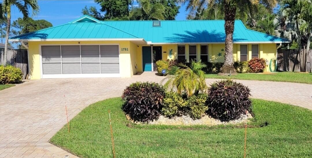 Create memories in this beautiful corner lot pool home in the heart of Port St. Lucie! This residence features a renovated kitchen with newer appliances, abundant cabinets and storage drawers. For your peace of mind this property has a newer Metal Roof (2025), a New AC (2026), newer Water heater (2025), and Plumbing (2021). Elegant Italian porcelain tile flooring flows throughout the entire home, creating a modern look. Other features include updated bathrooms, newer ceiling fans, a generous primary walk-in closet, screens for the garage and front door, beautiful landscaping, and fenced backyard . Step outside and enjoy a fully screened outdoor entertainment area featuring a pool and an extended patio. Perfect for hosting guests, or relaxing and enjoying Florida's year round sunshine. Conveniently located near shopping, dining, schools, and major highways, this well-maintained home offers the ideal combination of comfort, style, and outdoor living.
