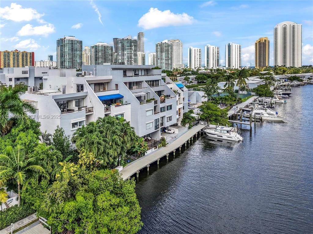 **Exceptional Waterfront Value-Add Opportunity** This is a rare chance to acquire one of the most significant waterfront properties in the area. Situated on one of the largest lots in the neighborhood, this expansive residence is the largest home in the community and offers direct waterfront access with private dockage for two boats. While the property requires substantial renovation, the fundamentals are outstanding. The bones of the home are excellent, providing a solid foundation for a complete transformation. For buyers with the vision, resources, and experience to undertake a major renovation project, the upside potential is truly extraordinary. The property's size, lot dimensions, waterfront location, and dockage create an opportunity that is increasingly difficult to find.  The scope of work has been carefully considered and is already reflected in the asking price, which is significantly below the property's potential market value once renovated so no low ball offers.   This property is best suited for financially qualified buyers prepared to take on a substantial project. Please review all photos carefully before scheduling a showing to ensure the property's current condition aligns with your expectations.  Serious inquiries only. This is a unique opportunity to create a premier waterfront estate while capturing significant value through renovation.