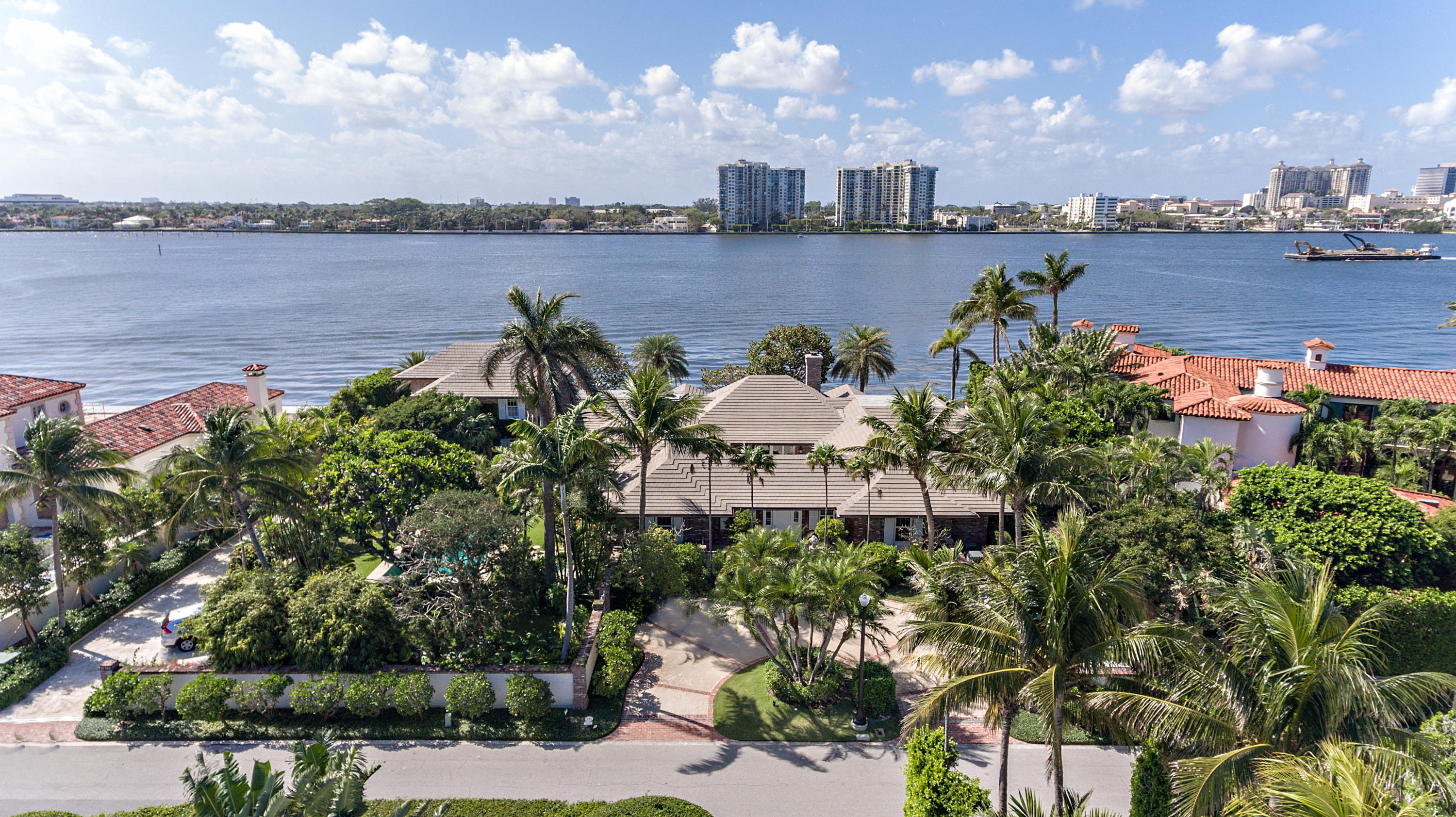 This Bermuda style home on Everglades Island epitomizes elegance and classical style. The home has 175’ of waterfront and encompasses 9,356 square feet. It has a most desirable western view with beautiful sunsets. This home was totally renovated in 2008 by Palm Beach architect, Tom Kirchoff. It is built around an atrium and all rooms open to the water or garden spaces. The tropical gardens were designed by Mario Nievera. This house has a spacious, comfortable master suite, five additional bedrooms, seven bathrooms and two powder rooms. The house flows beautifully for entertaining. Features include an exceptional kitchen, wine room, pool, spa, full house generator, impact windows and doors, lutron light system and a water filtration system. Truly a unique opportunity.