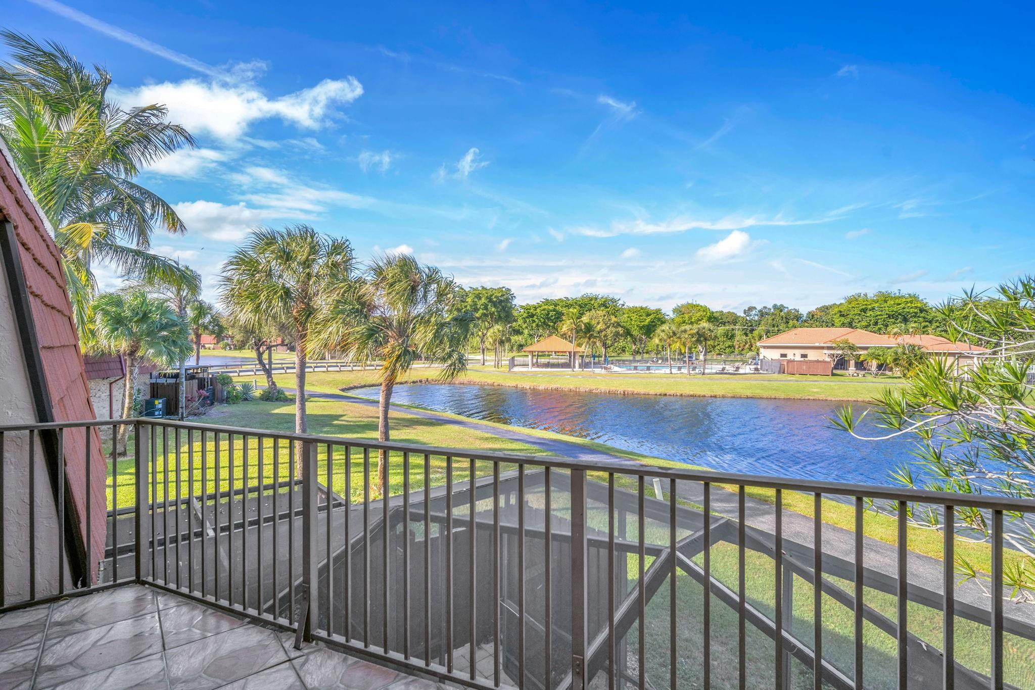 Wake up to stunning lake views from your private balcony! This updated 3BR/2.5BA townhouse offers 1,598 sq ft under air and is located in the highly sought-after Village at Boca Rio community. Enjoy scenic nature-filled walking trails, a resort-style pool, tennis courts, and clubhouse—all just steps away. Ideal for first-time buyers with low down payment options and situated in an A-rated school district. A rare opportunity to combine views, location, and lifestyle! PROPERTY BOASTS QUARTZ KITCHEN COUNTER TOPS AND BATHROOMS UPSTAIR,S ALSO HAVE KITCHEN COUNTERTOPS, ACCORDION SHUTTERS THROUGH OUT, TILE FLOORS UPSAITS AND DOWSTAIRS!  SELLER PAID $12,000 ROOF ASSSESMENT IN FULL THEREFORE BUYERS WILL NOT HAVE TO PAY IT! Wake up to stunning lake views from your private balcony! This updated 3BR/2.5BA townhouse offers 1,598 sq ft under air and is located in the highly sought-after Village at Boca Rio community. Enjoy scenic nature-filled walking trails, a resort-style pool, tennis courts, and clubhouse—all just steps away. Ideal for first-time buyers with low down payment options and situated in an A-rated school district. A rare opportunity to combine views, location, and lifestyle!