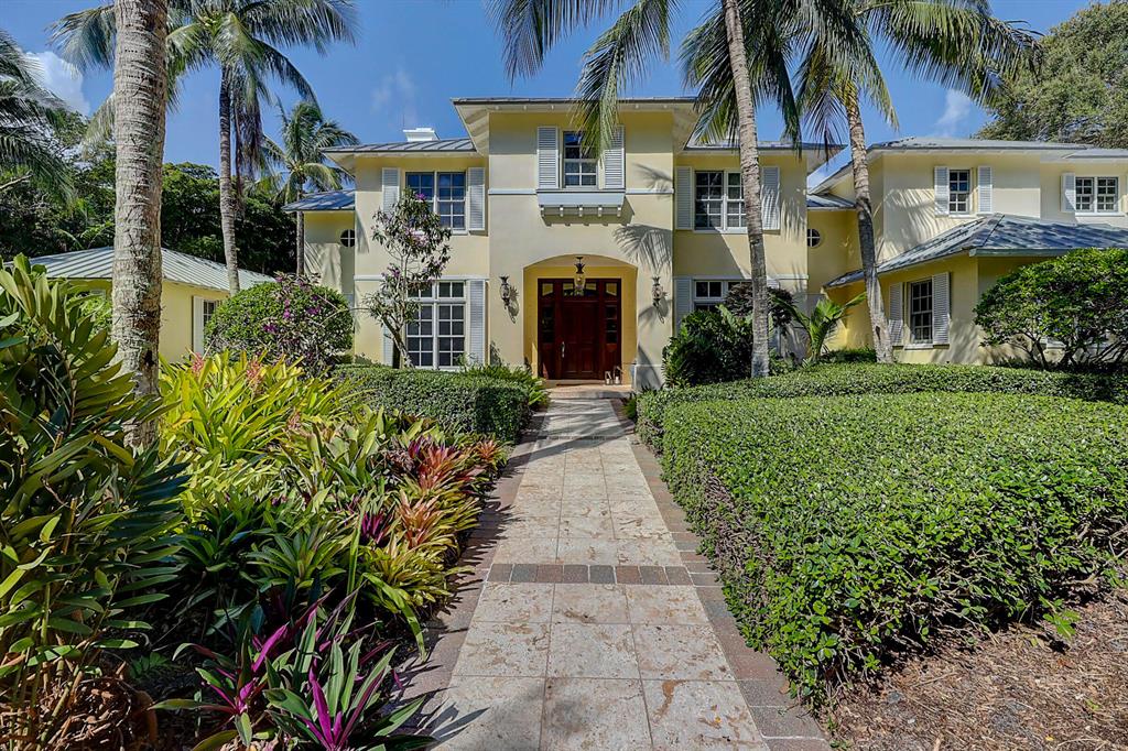 Welcome to Paradise in the beautifully quaint Town of Sewall's Point & this truly magnificent & private riverfront estate. Deep water dockage only minutes to the inlet with no bridges to impede your access to the ocean. A private white sand beach. Home built on a high coral rock bluff. Incredible native mature landscaping with huge trees & blooming plants. Swim in your infinity edge pool looking over the wide river. Magnificent estate & enjoy the beautifully crafted built-ins, gourmet kitchen & butler's pantry. Take the elevator up to the large master that looks over the pool from the private balcony. Guests, not problem, as you have an attached guest quarters to the main home with its own amenities & there are 2 more detached guest houses.