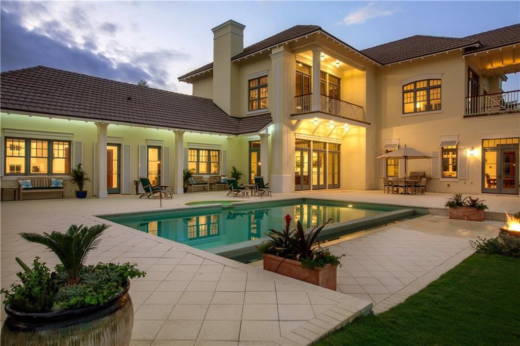 Featured as Wall Street Journal House of the Day! Inspired by French Caribbean plantation estates, this approx. 7,000 sqft oceanfront home is situated on private 1 ¾ acre estate lot with spectacular ocean views & 164ft of ocean frontage. Unfinished 1,000sqft carriage house apartment awaits your extended family. Near exclusive Ocean Drive & Moorings Club. Furnishings & 22' dock available