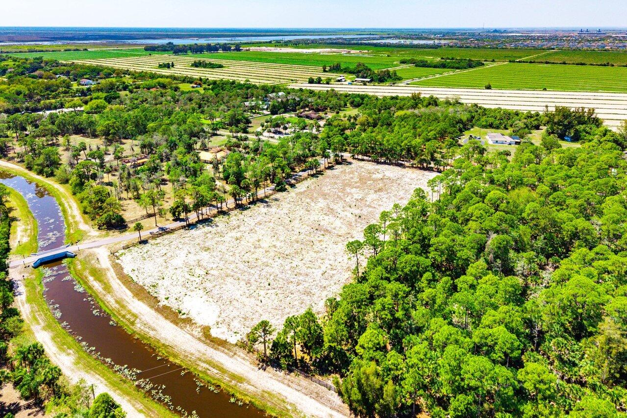 Build your dream equestrian estate on this exceptional 5-acre corner lot in the sought-after Fox Trail community. Fully cleared and ready for development, this prime parcel offers a rare opportunity to create a custom farm tailored to your vision. Enjoy direct access to miles of scenic riding trails, providing the ultimate convenience for horse enthusiasts, all within a tranquil and private setting.