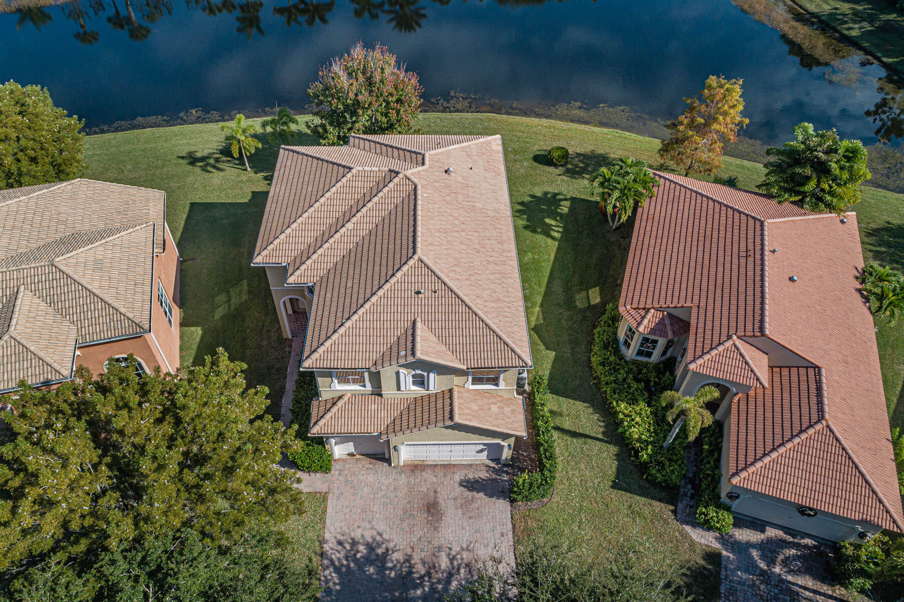 Beautiful lakefront home in the desirable gated community of Portofino Shores! Offering nearly 2,900 SF, this spacious 5-BD, 3-BA home features a flexible first-floor bedroom or den w/a full bath. The well-appointed kitchen offers granite countertops, wood cabinetry, and SS appliances. additional updates include newer carpet on the staircase and second floor, plus a painted 3-car garage. Exceptional amenities, including a heated saltwater Olympic sized pool, clubhouse, fitness center, tennis courts & a 24-hour manned gate. Located mins to I-95, the FL turnpike, beaches& dining. Priced to sell!