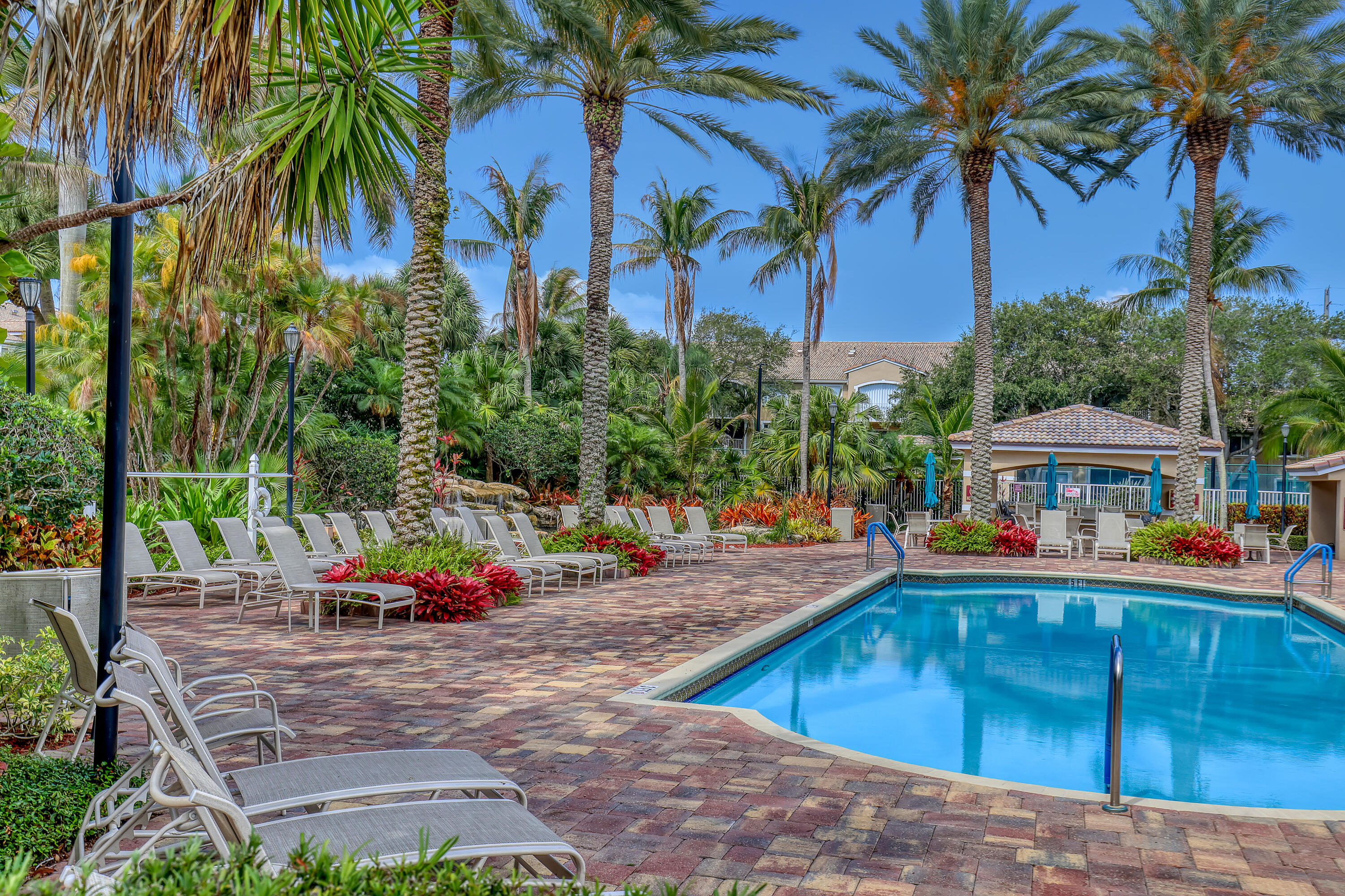 Rare opportunity to own a 3-bedroom, 2-bath corner sanctuary in the resort-style community of Lighthouse Cove in Tequesta. This 2nd floor condo features vaulted ceilings, split-bedroom floor plan & versatile second bedroom that can also serve as an office or den. A bright screened patio extends the living/dining space, creating the perfect setting to relax & enjoy the coastal breeze. The kitchen is appointed with custom solid wood cabinetry, granite countertops, newer appliances, an expansive pantry & a utility room with washer/dryer offering additional storage. Surrounded by lush, beautifully maintained landscaping, Lighthouse Cove offers exceptional resort-inspired amenities including PICKLE BALL/Tennis courts, expansive pool with Cabana beside tranquil waterfalls, grilling area, fitness center, pickle ball/tennis & racquet ball courts, sand volleyball, walking trails & a clubhouse with a billiard room, business center &  social room. Ideally located within walking distance of Publix, shopping, dining ~ just minutes from turquoise beaches, community parks, the Jupiter Lighthouse & Inlet, this condo blends convenience with a relaxed coastal lifestyle. The Association is financially stable with healthy reserves & no special assessments. Two pets up to 45 pounds each are welcome, subject to association guidelines. Association Rules/Regs/Applications attached under Documents tab for review.