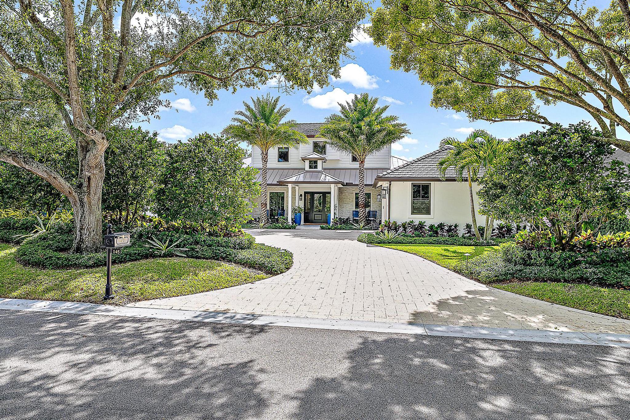 This custom estate home is the perfect blend of transitional elegance and coastal charm designed for those who seek the finest in Florida living.
Conveniently located close to the clubhouse in the heart of the community. Newly built in 2022 offering a new dock, long water views, and ample space for relaxation and entertainment. Featuring US forested Carlyle wide-plank oak flooring, electric shades, a large island with natural quartzite stone, Sub-Zero, Wolf, Bosch appliances, custom 100 bottle wine cooler, his and her primary bathrooms joined by a spa-like shower and tub wet room, Control4, Josh, Nest and MyQ. Sold fully furnished and turnkey. Required golf membership purchase conveys all the first class amenities of Admirals Cove including two spectacular clubhouses, 45 holes of golf, 5 restaurants, 58 slip marina with floating docks, Yacht Club, 9 har tru tennis courts, 12 pickleball courts, state of the art fitness and wellness center with Technogym machines, 21,000 sq ft spa & salon, 30 room Waterside Private Boutique Hotel for members and their guests, new Golf Learning & Entertainment Center, Covesters kids club, dog park offering platinum service. Seize the opportunity to indulge in a lifestyle of unrivaled luxury within Admirals Cove, a renowned enclave offering world-class amenities for discerning boaters and golf enthusiasts alike. Conveniently located close to the clubhouse in the heart of the community. Opportunity for a luxury lifestyle catering to boating and golf enthusiasts. Luxurious features in a new home offering warmth and comfort, immersed in the security and extensive amenities offered by the Admirals Cove community.