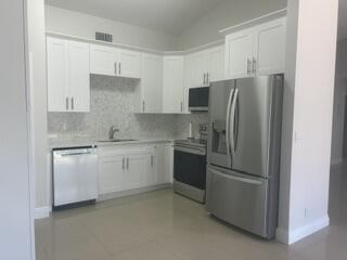 Welcome to this charming single-story residence in Boca Landings, featuring a brand new stylish white shaker kitchen with quartz counters and 42" Cabinets providing  extra storage. All new stainless steel kitchen appliances and also including a new washer and dryer. Freshly painted with wall to wall tile. Updated bathrooms too! Three bedrooms and two full bathrooms across 1,132 square feet The efficient one-story layout maximizes comfort and convenience, with all living areas on one floor . A single-car garage provides secure parking and storage solutions. Fully fenced yard. Community offers an Olympic size pool, kiddie pool, pickle ball, tennis, basketball, racquet ball and a tot lot. Cable and Fiber optic Wi-Fi is included in the rent.
