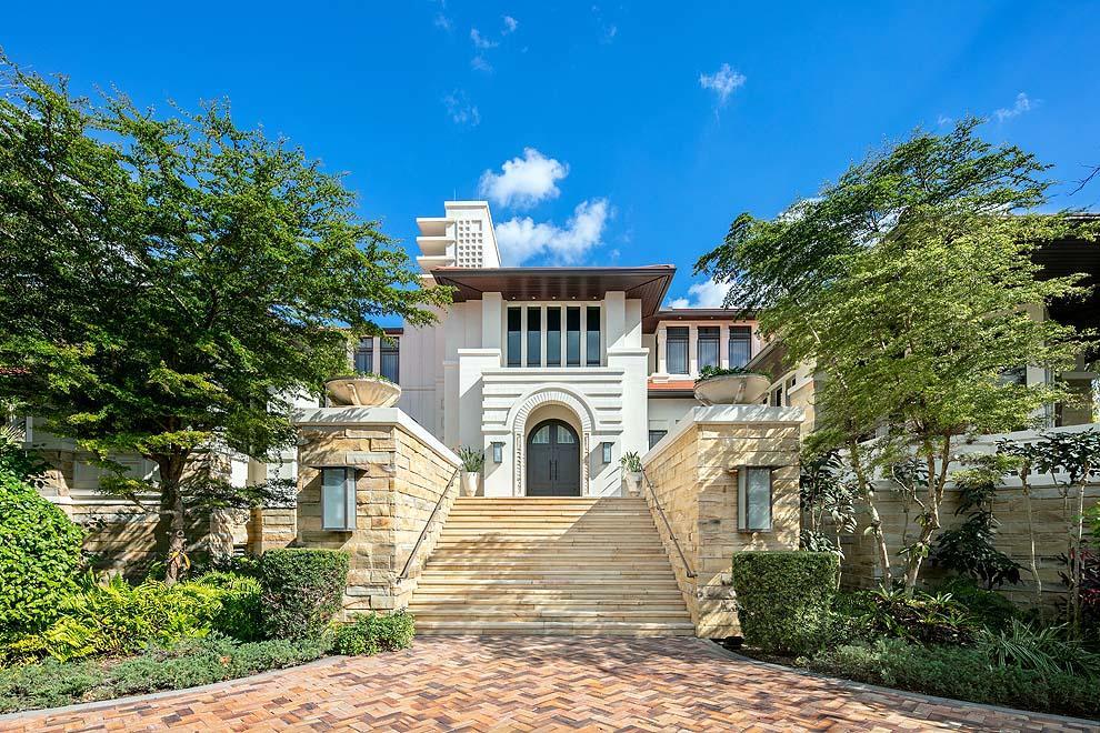 This stunning oceanfront compound offers 120 feet of direct oceanfrontage with incredible elevation and gorgeous ocean views. Inspired by the designs of Frank Lloyd Wright, the residence and grounds combine to create a tranquil oasis in the coveted Delray Beach Estate Section. Offering over 21,000 total square feet, the seven bedroom residence features spacious entertaining areas with walls of windows; ground level theater, gym and game room; main level master suite; private guest rooms plus staff quarters; two offices; and 8 plus bay garage. Enjoy manicured grounds; seaside pool with cascading waterfall; cabana bath with kitchen; covered loggia; putting green and bocce ball; and private path through expansive dune to the beach. Gated and secluded, this is the perfect oceanfront retreat. FEATURES:
" Over one acre of prime beachfront living with stunning ocean views and expansive dune
" 120' of direct oceanfrontage with over 400' of depth in Delray Beach Estate Section
" Exceptional elevation allows for stunning eastern views of ocean and tranquil setting amidst the tree line and foliage
" Designed by architect Randall Stofft / quality built by Cudmore Builders
" 7 bedrooms / 9.4 baths
" Over 13,700 square feet under air / over 21,400 total square feet
" Blocks to Atlantic Ave in Delray Beach and a pleasant drive along A1A to Worth Ave in Palm Beach to the north and Boca Raton to the south
" Gated compound with decorative motor court and ample parking
" Impressive entrance with steps leading to double front doors
" Foyer unveils breathtaking unobstructed views of ocean; volume ceilings open to upstairs with custom light fixture by a glass artist who has work in the Smithsonian; access to main stairway; and nearby powder room
" Floor to ceiling impact glass windows and French doors throughout
" Renovated kitchen with top-of-the-line appliances, lots of counters and cabinets, pantry, large breakfast area overlooking the ocean, pool and grounds
" Seaside family room off kitchen with ocean views and French door access to covered loggia
" Expansive dining room with peaceful backdrop of the tree line and foliage
" Butler's pantry with wine cellar
" Southwest office with access to outdoor terrace to enjoy sunset breezes amidst the foliage
" Private master wing with entry hall; seaside access to terrace and pool; dual baths; dual walk-in closets
" Northeast office with Juliette balcony
" Service hallway to elevator; laundry room; powder room; and back stairway to garage
" Upper level landing with wet bar, sitting area and private balcony
" Five en suite guest bedrooms
" Ground level theater; gym with access to beach garage; large game/entertainment room; morning bar; full spa bath; laundry room; and storage closet
" Garage has pull-in access with new flooring and ample room for 8 or more cars; Tesla charger; storage and access to north side pathway to grounds, pool and beach
" Ground floor staff quarters with bedroom and bath
" Ample covered and open terraces for outdoor living with stellar ocean views
" Tranquil river and waterfall feature that cascade down terrace levels to the pool 
" Cabana bath house with kitchen
" 4-hole putting green and bocce ball
" Private path through dune to beach and Atlantic Ocean
" Decorative pathways on north and south side of property connecting the front and back grounds
" Tropical landscape throughout with extensive custom lighting to accentuate the grounds
" Full house generator
" Impact glass windows and doors
" Smart house technology with secure dedicated tech room

Boasting 120 feet of direct oceanfrontage, this seaside oasis provides the perfect setting to enjoy luxury living.