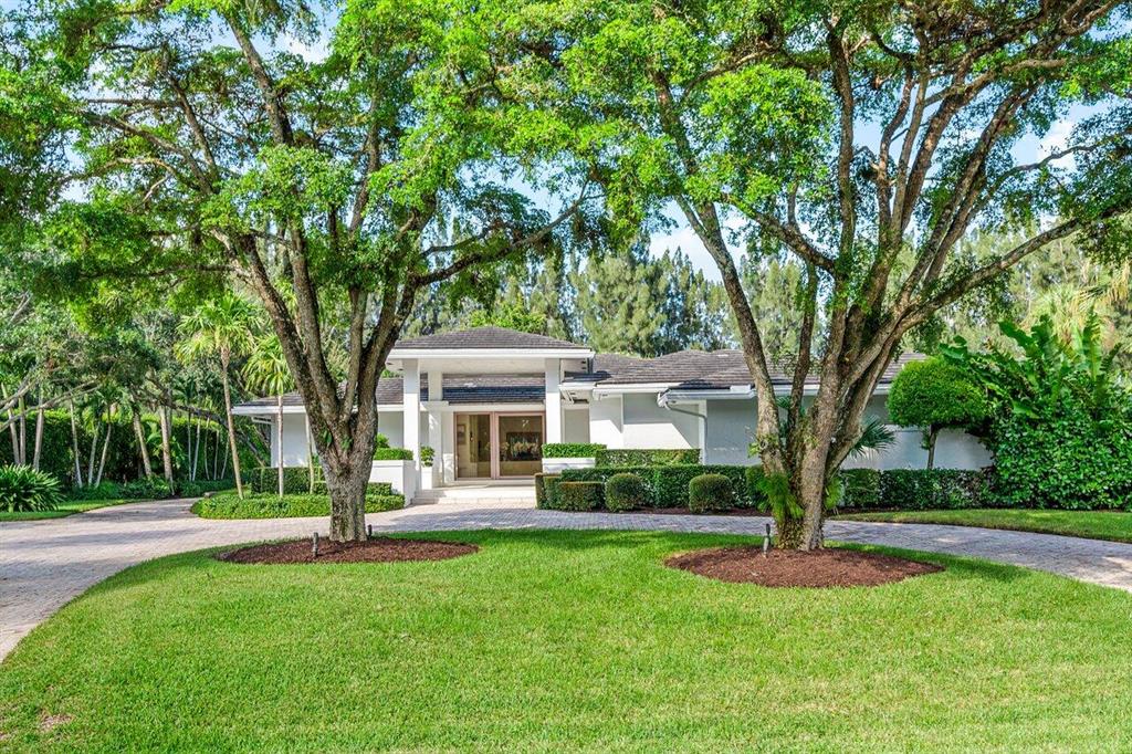 Charming, modern, completely renovated residence situated on a 1-acre lot in the prestigious gated community of Foxe Chase. Offering 5 bedrooms, 6baths  plus an office, 4 car garage complete with HVAC, and thoughtfully curated landscaping offering the ultimate in privacy. This home has been stylishly updated with custom contemporary finishes. Features include Wolf and Subzero appliances, wet bar, chef's kitchen with gas appliances,  a vast private yard with a resort-style pool, an outdoor dining area, covered loggia, motor court,  security system, outdoor lighting, an advanced water filtration system, an outdoor shower and so much more.