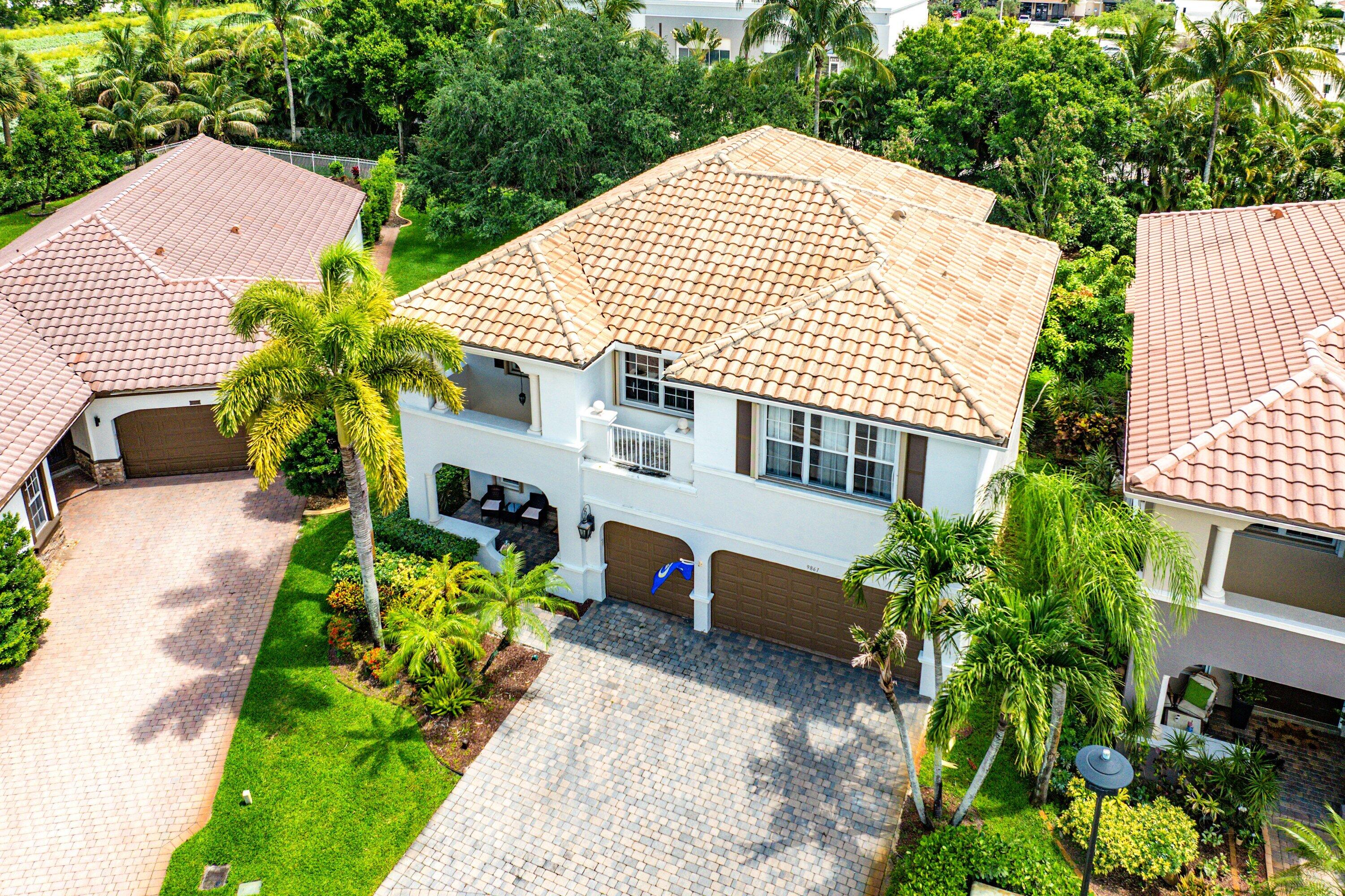 Welcome to 9861 Cobblestone Creek Drive, a spacious 5-bedroom, 3-bath home in the highly desirable gated community of Cobblestone Creek in Boynton Beach. Situated on an oversized cul-de-sac lot that is among the largest in the community, this 2-story residence offers the rare combination of generous interior living space and a private backyard with plenty of room to add a private pool. Inside, the home features approximately 3,396 square feet of living space with a flexible floor plan designed for everyday comfort, entertaining, and multigenerational living. The spacious layout features 10-foot ceilings on the first floor, multiple living areas, sizable bedrooms, and a 3-car garage, offering the space today's buyers are looking for. *Pool is a virtual rendering for visualization purposes. The first floor has a bedroom and full bathroom, laundry room, the main living and dining areas, as well as a spacious gourmet kitchen with a center island, double wall ovens, stainless steel appliances, wood cabinetry, and granite counters with a breakfast nook and bar seating, all open to the Family Room.  The second floor offers newer engineered wood flooring throughout, the master bedroom suite with dual walk-in closets and a spacious bathroom, additional guest bedrooms with walk-in closets, guest bathroom, and an open loft perfect for an additional living space or office.  The backyard is a major highlight, with a covered patio, tropical setting, and plenty of room to create your own South Florida outdoor retreat. Whether you envision a custom pool, expanded patio, summer kitchen, or lush private garden, the expansive private lot provides the canvas.  Cobblestone Creek is an upscale, 24-hour gate-manned community of just 250 homes, known for its impressive entrance with cascading waterfalls and lush tropical landscaping. Residents enjoy resort-style amenities including a saltwater pool and spa, children's water park, sun deck, cabanas, and an elegant clubhouse with a billiards room, and fully equipped fitness center. Reasonable HOA dues include access to these amenities, along with expanded cable and high-speed internet. Ideally located near top-rated public and private schools, restaurants, shopping, grocery stores, Bethesda West Hospital, Florida's Turnpike, I-95, and more, Cobblestone Creek offers a convenient and highly desirable Boynton Beach lifestyle.