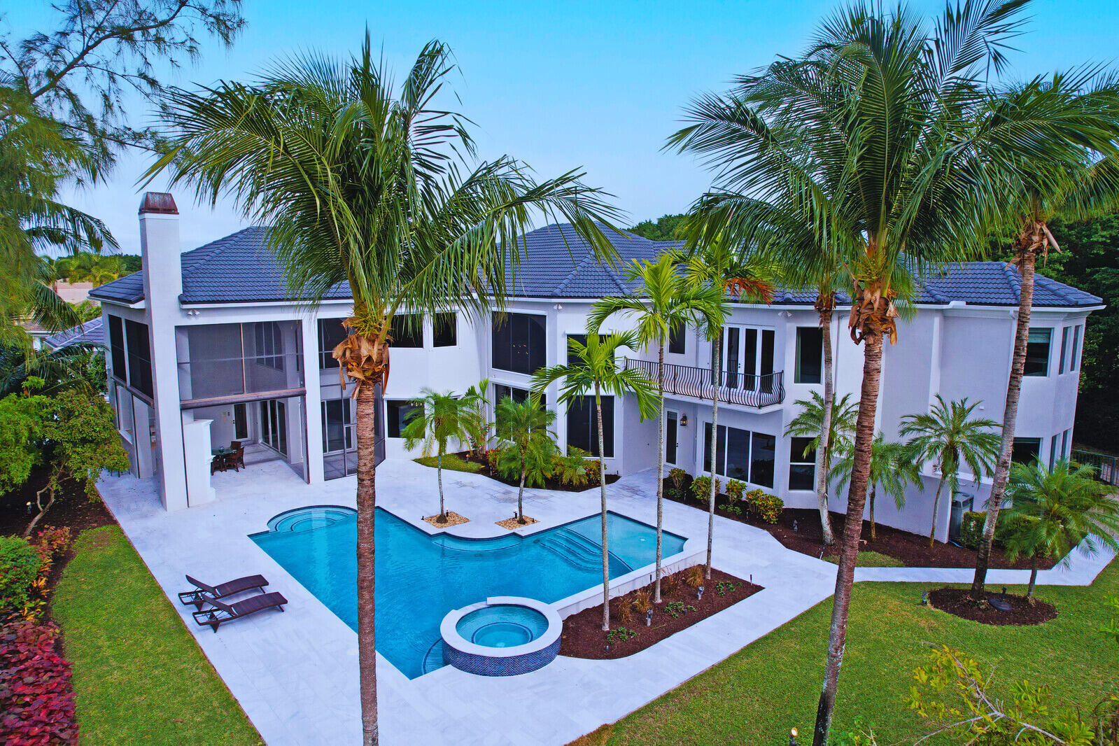 Experience unparalleled luxury with this extraordinary private gated estate—the largest home to hit the market in BallenIsles Country Club in years! You will not find another home this size at this price!  Recently renovated, this stunning property blends timeless elegance with modern sophistication, offering a rare opportunity to own a true masterpiece in one of South Florida's most exclusive communities. Located in San Marita, the newest subdivision in Ballenisles, this estate is perfectly situated on a premium high-elevation corner lot spanning nearly half an acre. With no south or rear neighbors, the property offers unmatched privacy and breathtaking views of the 10th hole of the golf course in the prestigious Ballenisles Country Club, awarded best in Palm Beach County Built in November 2005, this luxurious property boasts over 7,500 square feet of thoughtfully designed living space, with no expense spared. Highlights include private gated entrance on a custom corner lot, 22-foot vaulted ceilings, custom crown molding, solid wood doors, and an array of premium features. The estate includes 6 bedrooms, 8 baths (6 full and 2 half baths), an elevator, dual primary suites, an office, a bonus room, a loft, and a three-car garage. Additional features include a newly refinished pool and spa (November 2023) and too many upgrades to list. This estate, is priced at the lowest per square foot for comparable high-quality Country Club homes in the area. It's a must-see property that offers tremendous value!

As you approach the home, the beautifully landscaped grounds and oversized decorative driveway create a grand entrance, complete with a private security gate at the entry for added exclusivity and peace of mind. Inside, you are greeted by soaring 22-foot trey ceilings, marble and new hardwood floors, and exquisite custom details such as arched doorways, solid wood trim, and premium finishes throughout. Floor-to-ceiling impact windows flood the home with natural light and frame stunning views of the golf course and lush gardens.

The gourmet kitchen is a chef's dream, showcasing quartz countertops, a waterfall island, Thermador double ovens, a Thermador gas range, a Sub-Zero refrigerator, a wine fridge, and a hidden appliance nook. The adjacent great room and dining areas provide an ideal space for entertaining, with custom built-ins and seamless access to the outdoor living spaces. An expertly refinished wet bar, complete with a wine cooler, adds to the home's entertainment-ready appeal. A separate office with built-in shelving offers a private retreat for work or study.

The main-level primary suite is a luxurious haven, featuring a cozy gas fireplace, dual custom-fitted closets, and direct access to the serene gardens and pool. A spacious bonus room connected to the suite offers versatility for use as a gym, nursery, or lounge. The upper-level primary suite provides a private sanctuary, accessed via its own staircase or the home's elevator. This retreat includes a gas fireplace, a balcony with stunning golf course and pool views, an office, and an expansive custom dressing room. Three additional upper-level guest suites, each with private ensuite baths and walk-in closets, ensure comfort for family and guests. The loft, complete with a wet bar, offers a flexible space for relaxation or entertainment, along with spectacular panoramic golf views.

The resort-inspired backyard oasis, redesigned in 2024, is an entertainer's dream. It features a custom saltwater pool and spa with a sun shelf, refinished pool tiles, a new marble pool deck, and lush landscaping highlighted by mature palm trees. A covered lanai offers the perfect space for outdoor living, complete with a fireplace, summer kitchen, and ample areas to dine or lounge. With no south or rear-facing neighbors, the backyard provides unmatched privacy and tranquility.

This estate has been meticulously updated to include renovated bathrooms with premium finishes, new "Carrera Oak" hardwood floors, a completely updated kitchen with smart appliances, a refinished marble staircase, and updated lighting throughout. Additional enhancements include new automated entry gates, motorized lanai screens, a state-of-the-art security system, and a freshly painted modern exterior with custom landscape lighting.

Located in Ballenisles Country Club, this home offers access to world-class amenities, including three championship golf courses, a state-of-the-art tennis complex with 20 courts and 9 pickleball courts, a newly renovated grand clubhouse with fine and casual dining, and a premier sports complex featuring a fitness center, spa, pools, and a café. Residents also enjoy walking and biking trails, dog parks, and an active social calendar. Membership options include golf, racquet, sports or social memberships.

This exquisite estate is move-in ready and available fully furnished, offering an unparalleled opportunity to experience luxury living in one of the most sought-after communities in South Florida. Schedule your private tour today and discover the elegance and lifestyle that await in Ballenisles Country Club.