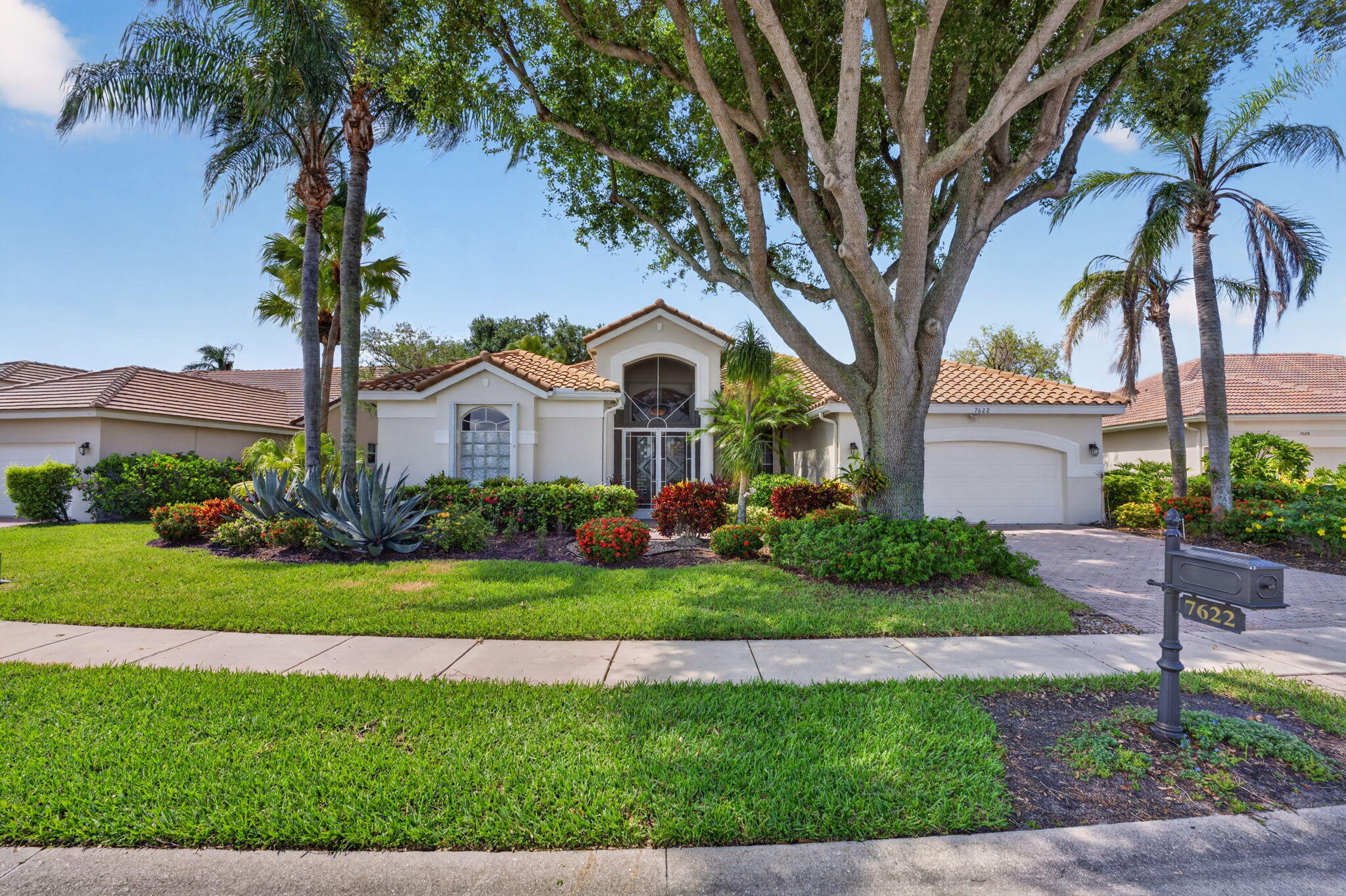 Welcome to Sterling Lakes in the Aberdeen Golf & Country Club in Boynton Beach. This home is located within a desirable club with mandatory membership.  This 3-bedroom, 3-bathroom residence offers over 2,563 square feet of living space. Notable features include high ceilings, crown molding, and ceramic tile throughout the living area. The beautifully split floor plan includes a large, light-filled sunroom adjacent to the living room, creating an open and airy atmosphere. You can also enjoy water views from the living room, kitchen, atrium, and primary bedroom. This is a desirable floor plan in Aberdeen.  The property includes a 2-car garage, an entire-house generator, and two Carrier AC units installed in 2016. The roof was replaced in 2009. Aberdeen Country Club is a  mandatory membership club with a one time buy in fee & annual fee depending on membership chosen. access to the golf course, tennis and pickleball courts, bocce ball courts, 3 restaurants, resort style pool and an array of activities that cater to diverse interests. Countless social events!