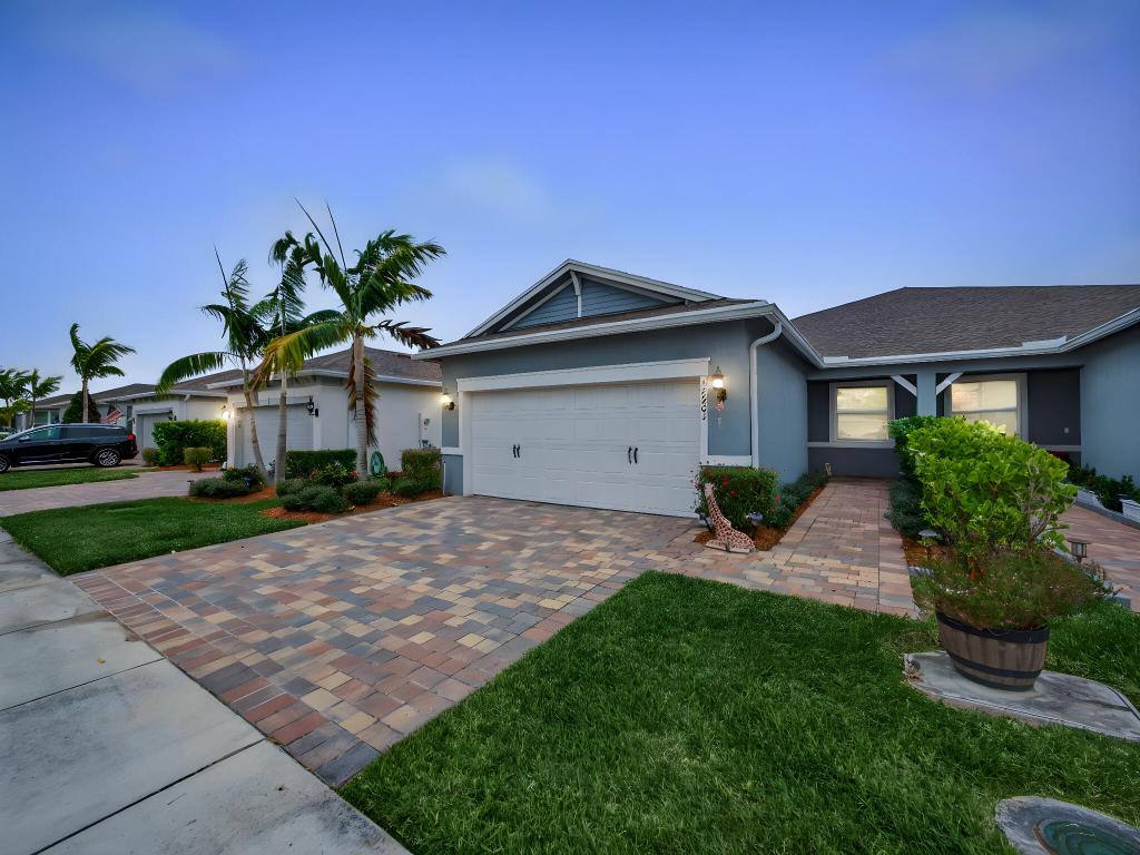 Welcome to this beautifully maintained 2-bedroom plus den, 2-bathroom villa in the highly desirable Del Webb at Tradition, a premier 55+ community. This home features an open and spacious floor plan filled with natural light, ideal for comfortable living and entertaining. Tile flooring throughout offers a clean, modern look and easy maintenance. The updated kitchen is the heart of the home, showcasing a granite center island, gas range, and ample cabinetry. The versatile den is perfect for a home office or guest space. Impact glass windows provide peace of mind and efficiency. Enjoy resort-style living at Del Webb at Tradition with a clubhouse, fitness center, pool, tennis and pickleball courts, and an active social calendar. Centrally located near shopping, dining, and Cleveland Clinic.