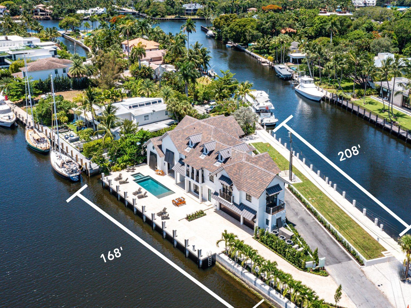 Discover waterfront luxury in Las Olas Isles, Fort Lauderdale. This architectural masterpiece, designed by Art Bengochea, boasts 6 beds, 6.5 baths, and spans 6,759 sq ft. Enjoy 376 ft of waterfront with two docks catering to boating enthusiasts. The chic great room offers soaring ceilings and expansive glass windows, seamlessly blending indoor-outdoor living. The gourmet kitchen features custom cabinetry, marble counters, and high-end appliances. The primary suite opens to tranquil waterfront views, boasting dual walk-in closets and a spa-inspired bathroom. Upstairs, a secondary primary bedroom and two guest suites ensure ample accommodation. Equipped with Lutron Control 4 system, an air-conditioned garage, and a 48kw generator. Just minutes from downtown and the airport, this residence epitomizes luxury living.