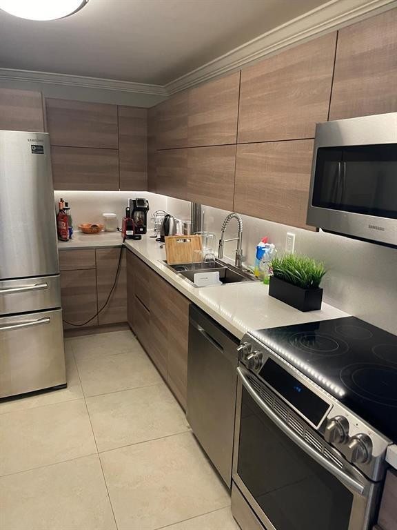 Beautiful Unit. Resort Style community. Large living room with balcony. Street view and partial view to the ocean. updated Kitchen. Furnished unit but it's optional fro the Buyer to keep. Tile throughout the unit , two AC units inside . Laundry room on the same floor, not in the unit.  BBQ area, pool, gym, reading room or play room. minimum rental period six month. there is a Publix supermarket just by the building. this buidling is by the intracoastal. Impact windows in all the unit .