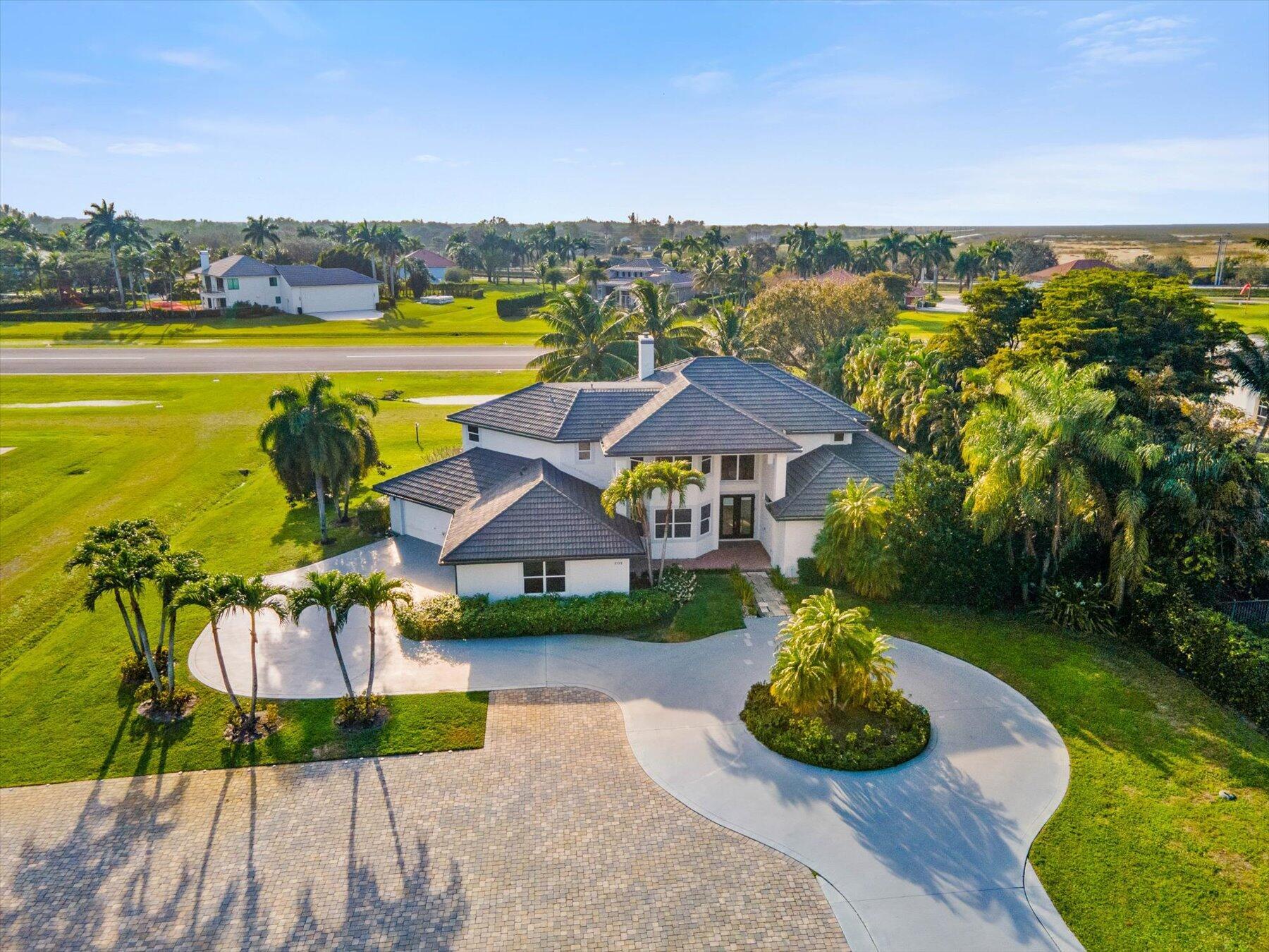 Only serious buyer may register to see the property. Perched along the runway in Wellington's exclusive Aero Club, this turn-key estate pairs luxury living with true fly-in/fly-out convenience with Private Runway. The 4,500-sq-ft layout features five expansive en-suite bedrooms, a sun-lit great room, and a chef's kitchen that opens to travertine-lined outdoor living. Nearly an acre of manicured grounds showcases a heated salt-water pool, fenced yard, dual two-car garages, and a dedicated aircraft parking pad with direct taxiway access. Golf-cart minutes to Wellington International, polo, dining, and shopping—yet under 30 minutes to PBIA and Palm Beach beaches—this is a rare chance to secure a runway estate in Florida's equestrian capital.