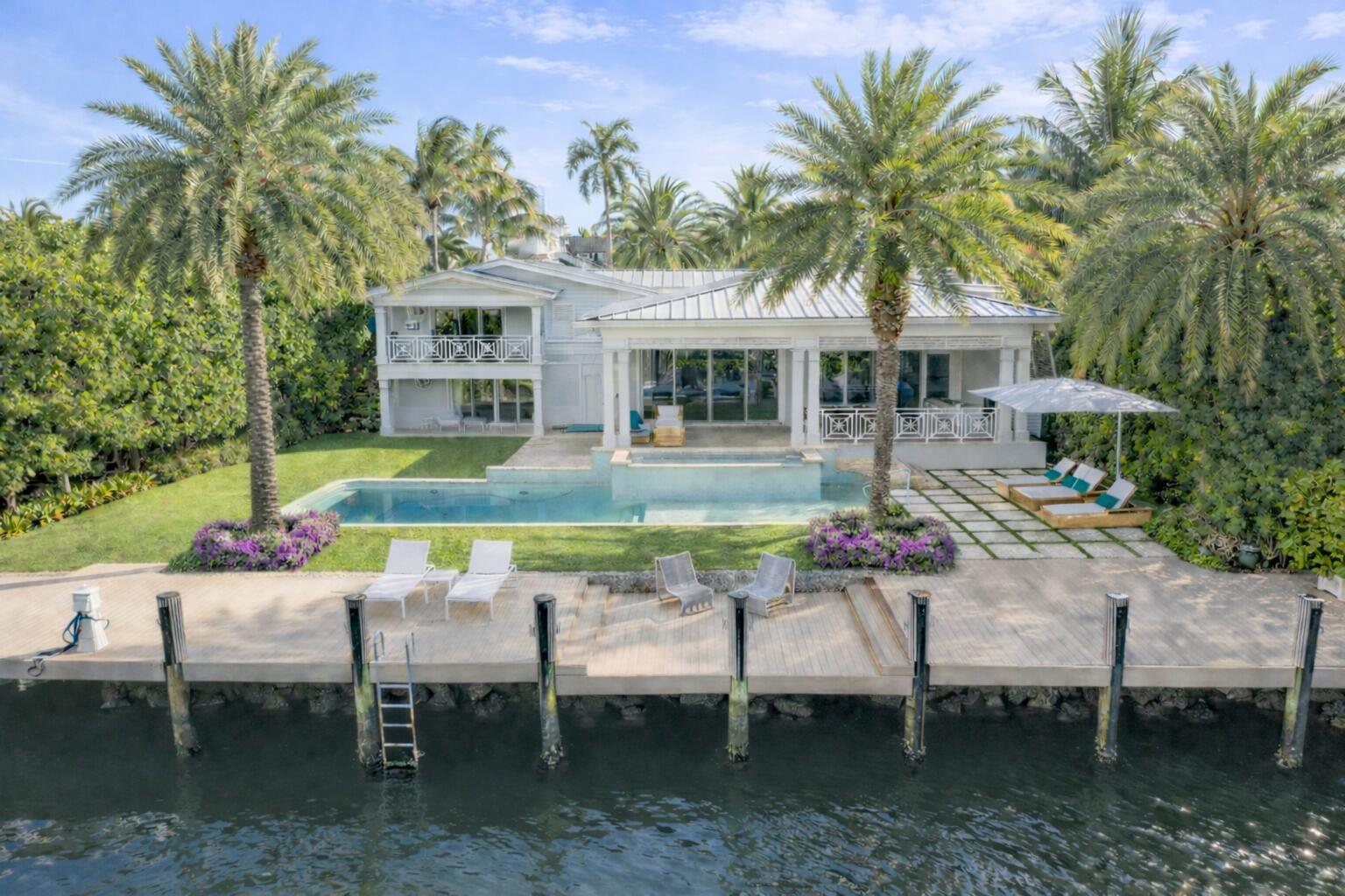 An exceptional waterfront estate in the coveted Rio Vista neighborhood of Fort Lauderdale, this residence is set along a rare, one-of-a-kind wide-body canal, offering an unparalleled sense of openness and privacy. With 100 linear feet of deep-water frontage and a private dock, it presents an extraordinary opportunity for the discerning buyer seeking a life defined by water, light, and refined living. Set on an expansive 12,500 square-foot lot, the property features a seamless indoor-outdoor lifestyle with pool, spa, covered loggia, and direct Intracoastal access — all framed by lush tropical landscaping and towering palms.