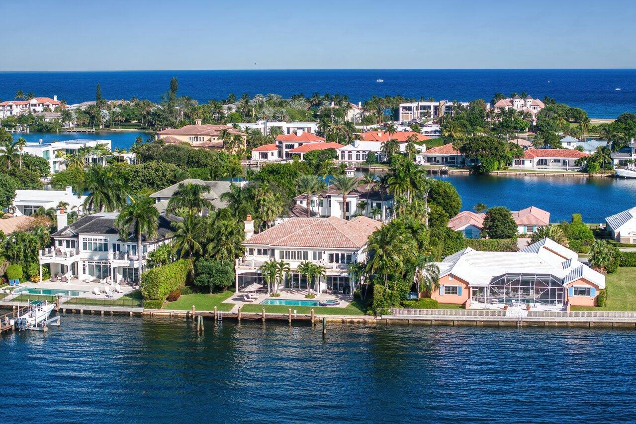 Exquisite 2-story Mediterranean waterfront home in secure, exclusive Manalapan Built by the famed luxury Hampton builder Farrell, this incredible 6,214 SF home has 5/BR and 6.5/BA and provides spectacular views and direct access to the deep, wide water Intracoastal Waterway. 
Enter the arched front door into the open floor plan with gorgeous marble and wood flooring and crown molding throughout. The 12ft height living room has an open bar area and wine room and there are custom French doors lead to the outdoor loggia, heated pool, spa, and dock. Many of the home's rooms feature unique tray ceilings, and all have custom crown molding finishes. The Christopher Peacock gourmet kitchen features commercial grade stainless steel appliances, a gas range, a spacious granite counter breakfast bar and center island prep area, a butler's pantry as well as a large in-kitchen dining area. The more private formal dining room with a Schonbek chandelier, is a few steps away and provides guests with lovely views of the lushly landscaped yard.

The large second floor master suite has both a lovely open sitting area with "his & her" walk-in closets, and the master bath has a beautiful view of the intercoastal.

To access the second floor, use either of the two beautiful, stairways or take the elevator to the second master suite as well as the other family and guest bedrooms. The upper master suite features "his & her" master baths, and a walkout deck that overlooks the pool and Intracoastal Waterway. The first floor also has a spacious library/den/office area that provides quiet privacy.

Additional amenities include impact windows and doors, electricity and water hook-up at the dock, no fixed bridges to access the Atlantic Ocean, and a 3-car attached garage with additional storage area, 
 
Manalapan home ownership and residency comes with a gratis membership to the La Coquille Club located in the EAU Hotel, a cherished part of the Manalapan experience. Members are granted access to the club's and hotel's many amenities, including pool, spa, private beach, tennis, golf, a business center, and the fitness and club room. Members are not charged initiation or fees and are billed only for the goods and services enjoyed while at the club with a 10% discount.

Additional advantages to living in Manalapan are the town's private police force, the nearby library, and the lowest property tax base in Palm Beach County. All of this is within a few minutes' drive of some from Palm Beach's best upscale shopping and dining.