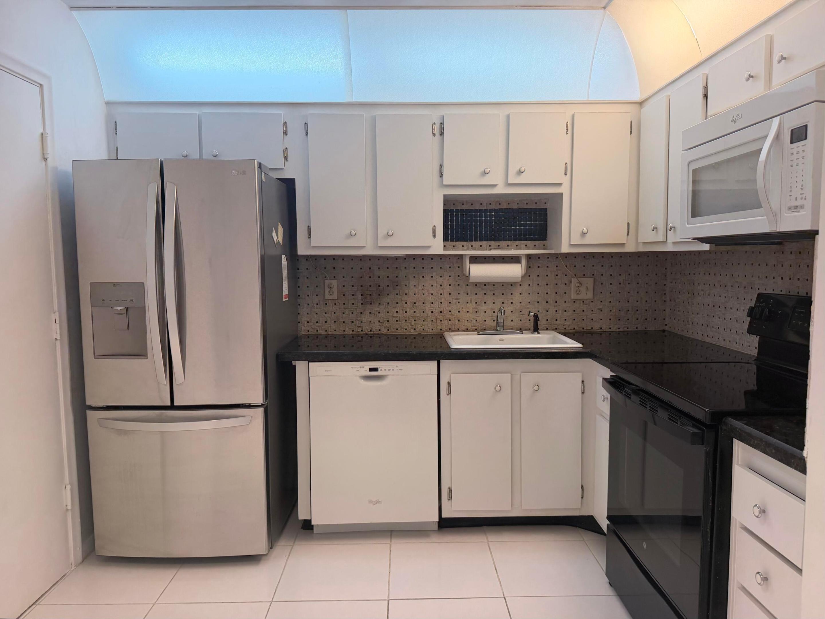 Welcome to Castle Gardens, a vibrant 55+ community offering an exceptional lifestyle with an impressive array of amenities just steps from your front door. Residents enjoy a clubhouse, billiards room, bowling, fitness center, community pool, and a variety of social activities, along with complimentary shuttle services.  This charming 1-bedroom, 1.5-bathroom condominium is full of potential and ready for your personal touch. The unit has been freshly painted throughout and features a brand-new air conditioning system,  engineering wood flooring throughout the main living area, a stainless steel refrigerator, and a spacious walk-in shower in the master bath. While it could benefit from some TLC, it offers great value and an excellent opportunity to customize the space to your taste.