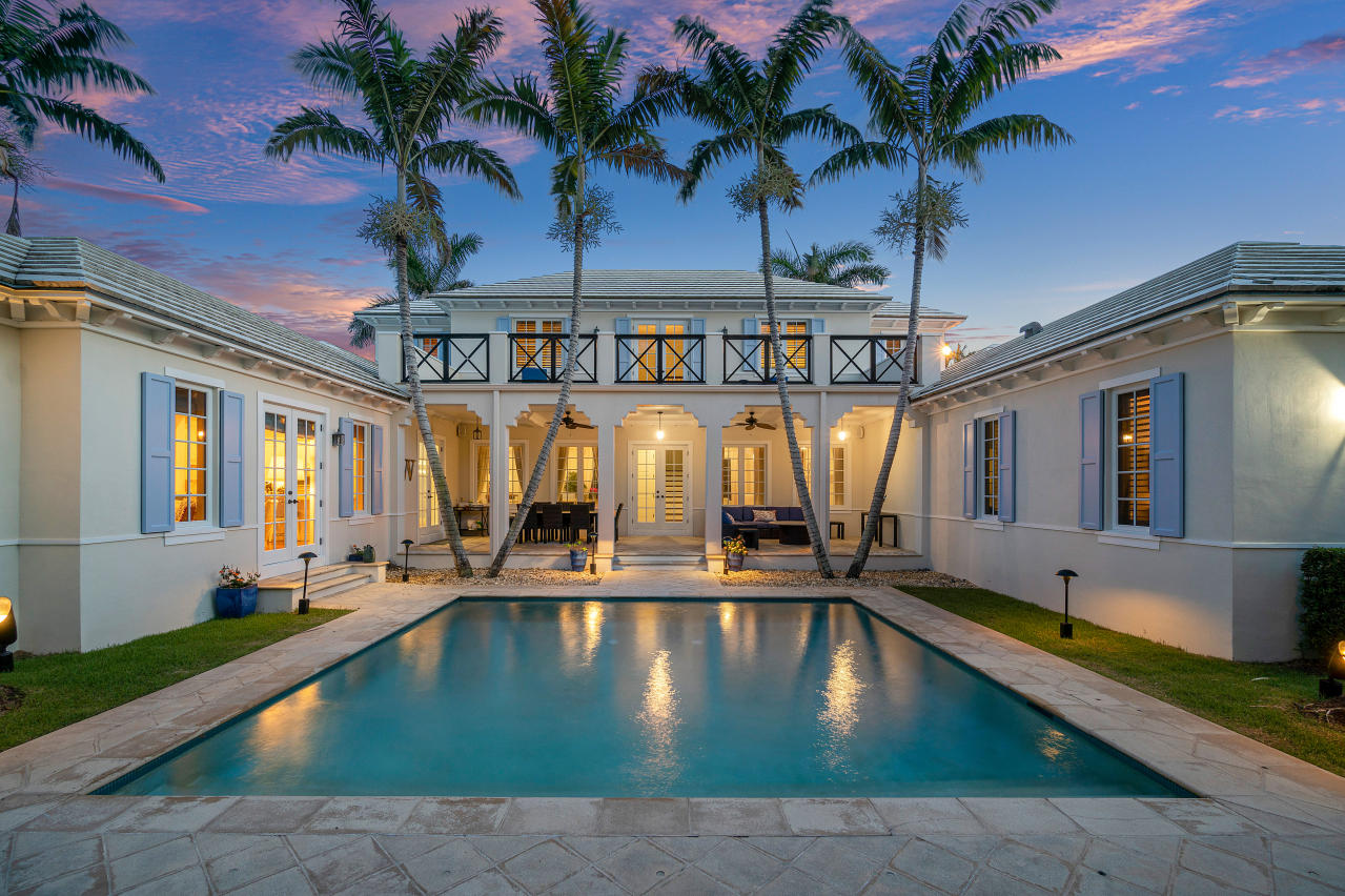 Nestled in the core of Gulf Stream and only one block from the ocean, this five bedroom and 6 full bath home with 6,057 TSF is ideally situated on a generous property with dual street parking. The residence is an absolute architectural gem with fine interior features, such as a first-floor master, vaulted ceilings with tongue and groove detail, impact doors and windows, Brazilian hardwood floors, and custom moldings. Living room with beamed ceilings, and fireplace add to the allure of the home. A generous outdoor loggia and cabana bath lead directly to the pool and are surrounded by lush tropical landscaping. Just steps to a deeded beach access and the Gulf Stream School. Two garage. Move in now and enjoy
