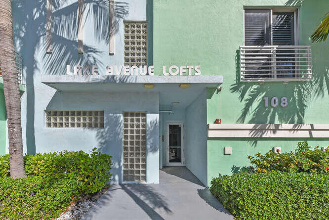The main level offers a newer custom kitchen with marble countertops, high-end appliances, and an island with seating, along with an open dining area, living room, a spacious guest bedroom, and a full bath/powder room. Upstairs, the primary suite has been updated with additional closet. An open loft/den adds a versatile secondary living area—ideal for an office or lounge—with views toward the Intracoastal. Building amenities include a rooftop pool, private storage, and two covered parking spaces with electric car hookup. The location provides easy walkability to Lake Worth Beach's pier and oceanfront, local restaurants and shops, Bryant Park, the municipal golf course, and so much more. Call the Listing Agent for the list of additional upgrades.