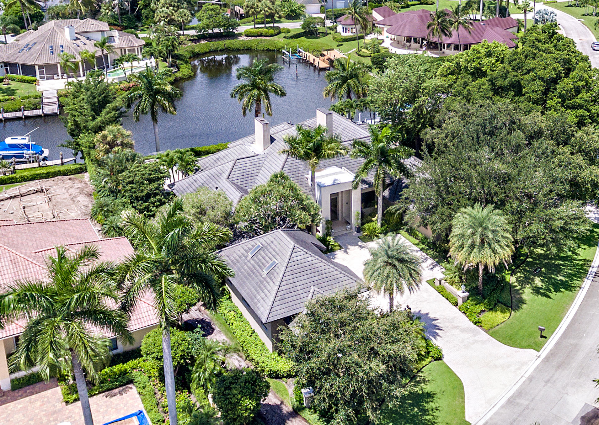 Stunning remodel, incredible waterfront lot w/86' dock. Ocean access. Extremely spacious w/a total of 6 BR, 7.5 baths, & 4 car garage w/2 golf cart spaces. Main house offers 3 BR & 3.5 baths, completely re-designed w/the finest material & craftsmanship.Floor to ceiling Impact Glass windows in nearly every room w/spectacular views. Neutral, open & extremely bright. Kitchen is outfitted w/top of the line everything; double ovens, 2 dishwashers, 6 burner stove w/griddle & wine cooler & is open to the Family Room w/gorgeous views. Luxurious Master Suite w/spa-like Master Bath.Each Guest Suite designed w/ensuite bath. Phenomenal Outdoor Living w/infinity pool & separate hot tub. 2 story guest house w/2 BR, 3 baths, full kitchen, living area & loft. Separate 2-story 3 car garage w/1 BR & 1 bath.