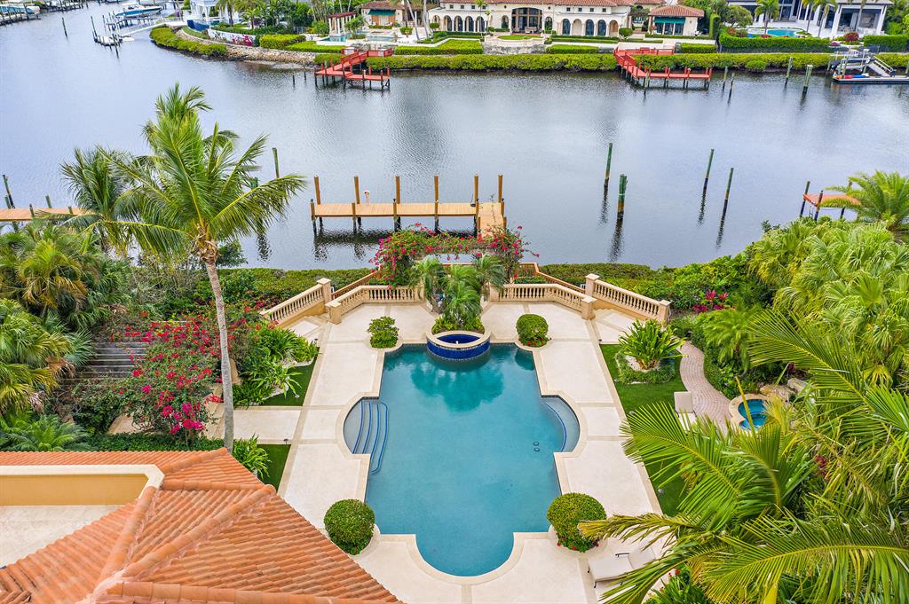 This European Masterpiece is waiting for you.  This home has been meticulously maintained and cared for. Enjoy countless hours in the well manicured back yard around the resort setting and pool and top it off with fabulous sunsets. Formal living room with high ceiling, marble floors and gas fireplace are perfect for entertaining. Pamper yourself in the  lavish master suite with large sitting room over looking interior  waterways,  his & hers baths and walk-in closets.  110' of waterfrontage with protected dock for an 80' boat.  This house is being offered furnished.