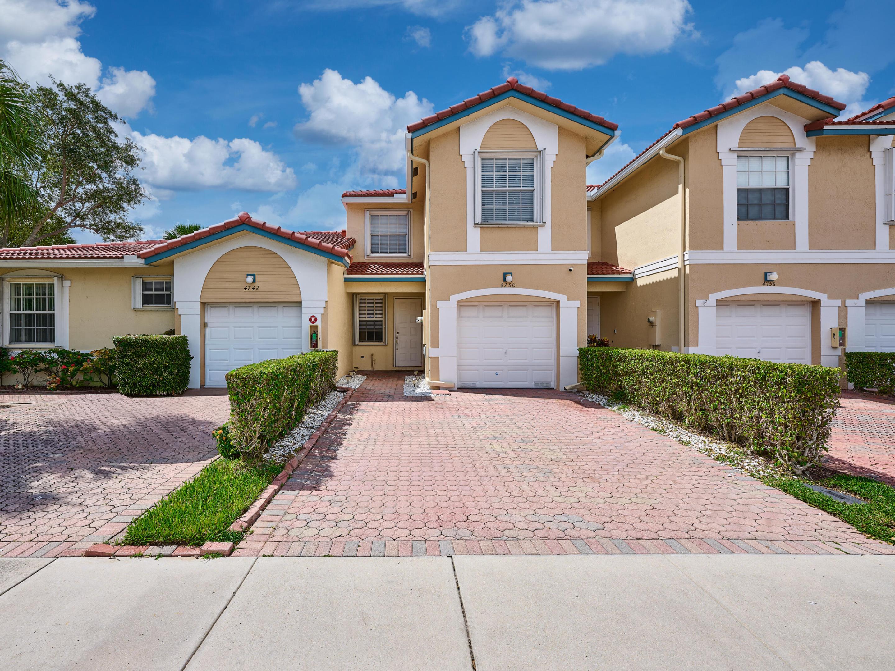 MOTIVATED SELLER, PRESENTING ALL OFFERS!! In the gated serenity of Pelican Point at Wyndham Lakes, this refined two-story townhome offers sunlit interiors where an open living room meets a bright, practical kitchen for effortless daily living and elegant entertaining. Upstairs, tranquil bedrooms and a full-size laundry enhance privacy and ease. A brand-new roof, newer flooring, central A/C and appliances, plus full accordion shutters ensure turnkey confidence. An attached garage and two-car driveway add convenience. Residents enjoy manicured grounds and a sparkling pool, with the HOA overseeing roof care, exterior painting, landscaping and pest control, true lock-and-leave living. Minutes to acclaimed schools, parks, dining, shopping and major arteries.  Perfectly positioned near top-rated schools, shopping, dining, and easy highway access, this Coral Springs townhome delivers both lifestyle and location. Don't miss your opportunity to enjoy the best of South Florida living in Wyndham Lakes.