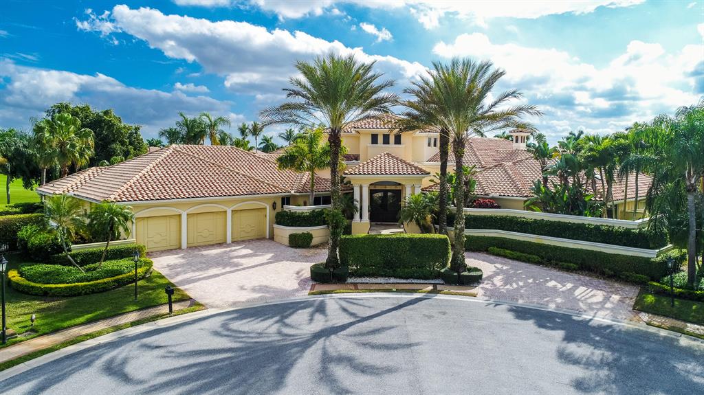 Prepare to be captivated the moment you drive into the cul-de-sac and are welcomed by this impressive Mediterranean home with 280 degree panoramic lakefront views and golf course views in the exclusive community of St. Andrews Country Club. This refined European-inspired masterpiece is situated on a spectacular .86 acre trophy lot. A graceful entry sets the timeless tone of this 5 bedroom, 7.1 bath residence with 7,601 square feet under air. The classic look is fashioned with custom architectural elements, exquisite designer finishes, marble floors and stunning ceiling treatments throughout. The flow functions beautifully for entertaining with French doors to the outdoor living area and private pool and spa in a relaxing resort-like oasis surrounded by huge palms, trees, grass, and lush foliage. The first floor includes a formal living room, formal dining room, a gourmet chef's kitchen with state of the art appliances, butler's pantry, breakfast room and large family room all designed for effortless entertaining or casual living. The master wing includes a grand master suite with luxurious his and her marble baths, generous closets and an exercise room and private office that opens to an outdoor screened in porch. There are 4 en suite bedrooms also on the first floor. Upstairs is a large office with bathroom and balcony that overlooks the pool, lake and golf course vistas.The information herein is deemed reliable and subject to errors, omissions and changes without notice. All measurements are approximate. ALL CHANDELIERS ARE EXCLUDED.