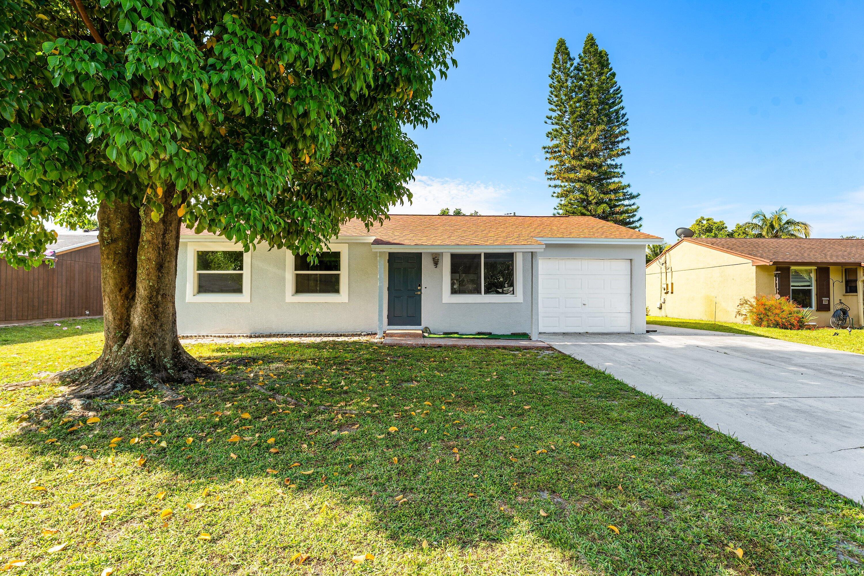 Welcome to this beautifully updated 3-bedroom, 2-bath single-family home offering the perfect blend of comfort, style, and freedom.  Recent upgrades provide peace of mind, including a brand-new roof, new air conditioning system, and impact windows installed throughout most of the home. The exterior has been refreshed with new stucco, giving the property a clean, modern look and excellent curb appeal.  Inside, you'll find a functional layout with spacious living areas and plenty of natural light, ideal for both everyday living and entertaining.  Situated on a large lot, this property offers ample space plus room to expand, garden, or create your own outdoor oasis.  Located in a highly desirable area, you're just minutes from shopping... dining, schools, and major roadways.  Move-in ready and packed with upgrades—this is the one you've been waiting for.