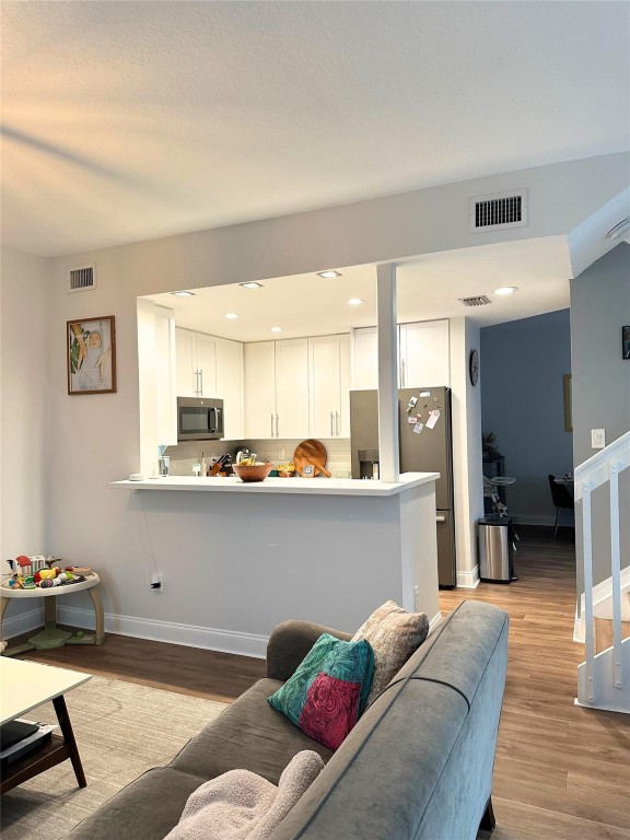 Beautifully situated on a premium corner lot, this 3-bed 2.5-bath townhome in the gated Villas at Harbor Isles is filled with natural light throughout. The first floor features an inviting open layout with a beautifully updated kitchen, dining area, living room, family room, & a convenient half bath—perfect for everyday living & entertaining. Enjoy outdoor space with a front entry patio & a back porch ideal for relaxing.Upstairs, all 3 bedrooms  along with the laundry for added convenience. Notable upgrades include hurricane-impact windows & sliding doors (22), a newer AC (23), tankless water heater (2026), stainless steel appliances, & a whole-home water filtration system(24). Residents enjoy 24/7 gated security, a community pool, & playgrounds. Ideally located just 10 minutes from Fort Lauderdale Airport, 15 minutes from the beaches, and 6 minutes from Dania Pointe, offering unbeatable convenience to shopping, dining, and entertainment.