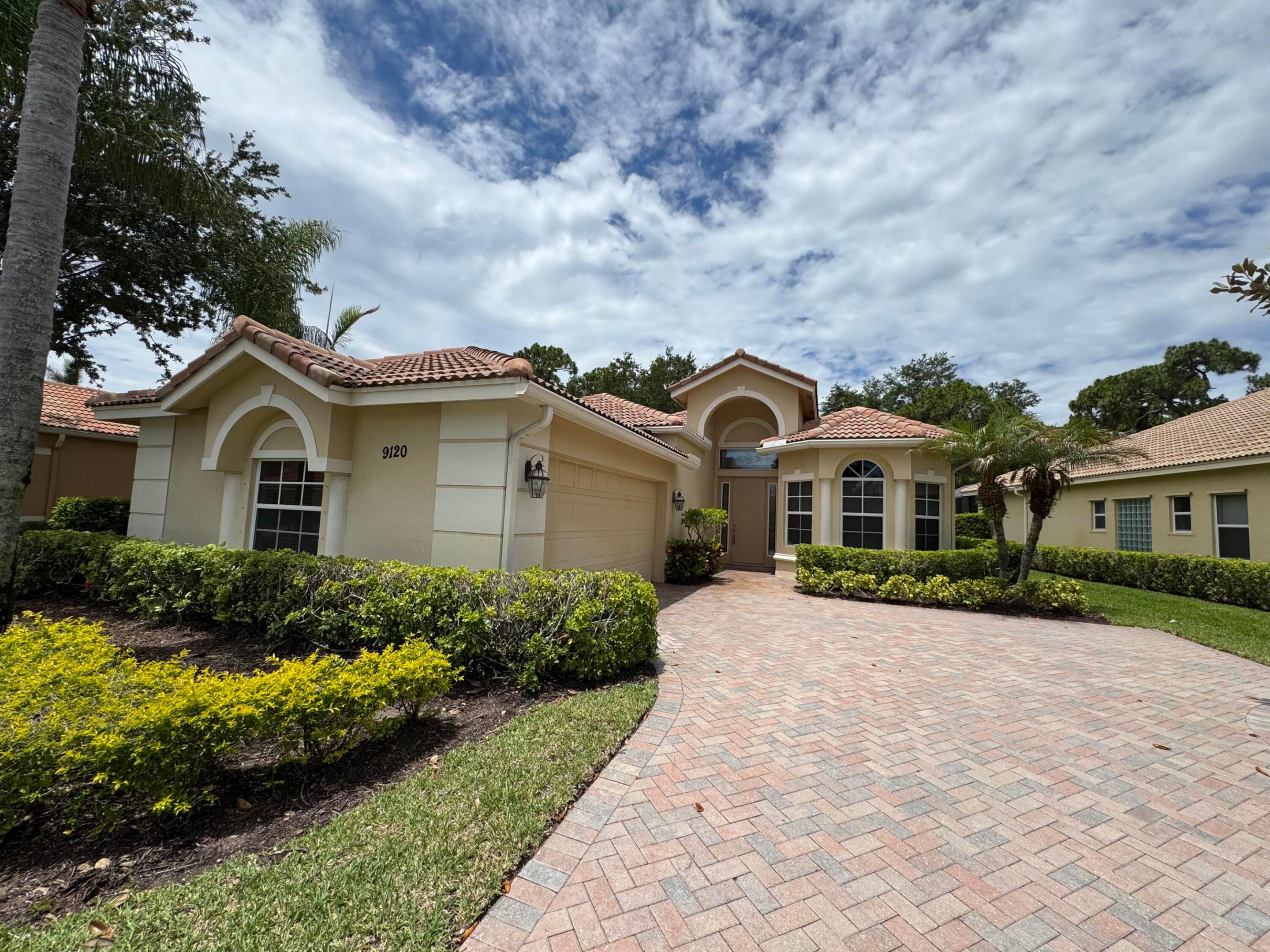 Welcome Home to Luxury and Comfort!  Step into this stunning 3-bedroom, 2-bathroom home, where soaring high ceilings and elegant coffer detailing in both the living room and master suite create an immediate sense of grandeur. At the heart of the home is a beautifully remodeled kitchen, complete with granite countertops, premium appliances, elegant chandeliers, and cabinetry that extends beautifully to the ceiling. The master suite is a true retreat, now featuring a luxurious soaking tub and bidet.  Elegant porcelain tile flows seamlessly throughout the main living areas, stretching all the way into the pristine, fully tiled garage. For your conveniences a built-in central vacuum system. Private, screened-in patio offers the perfect comforting area.