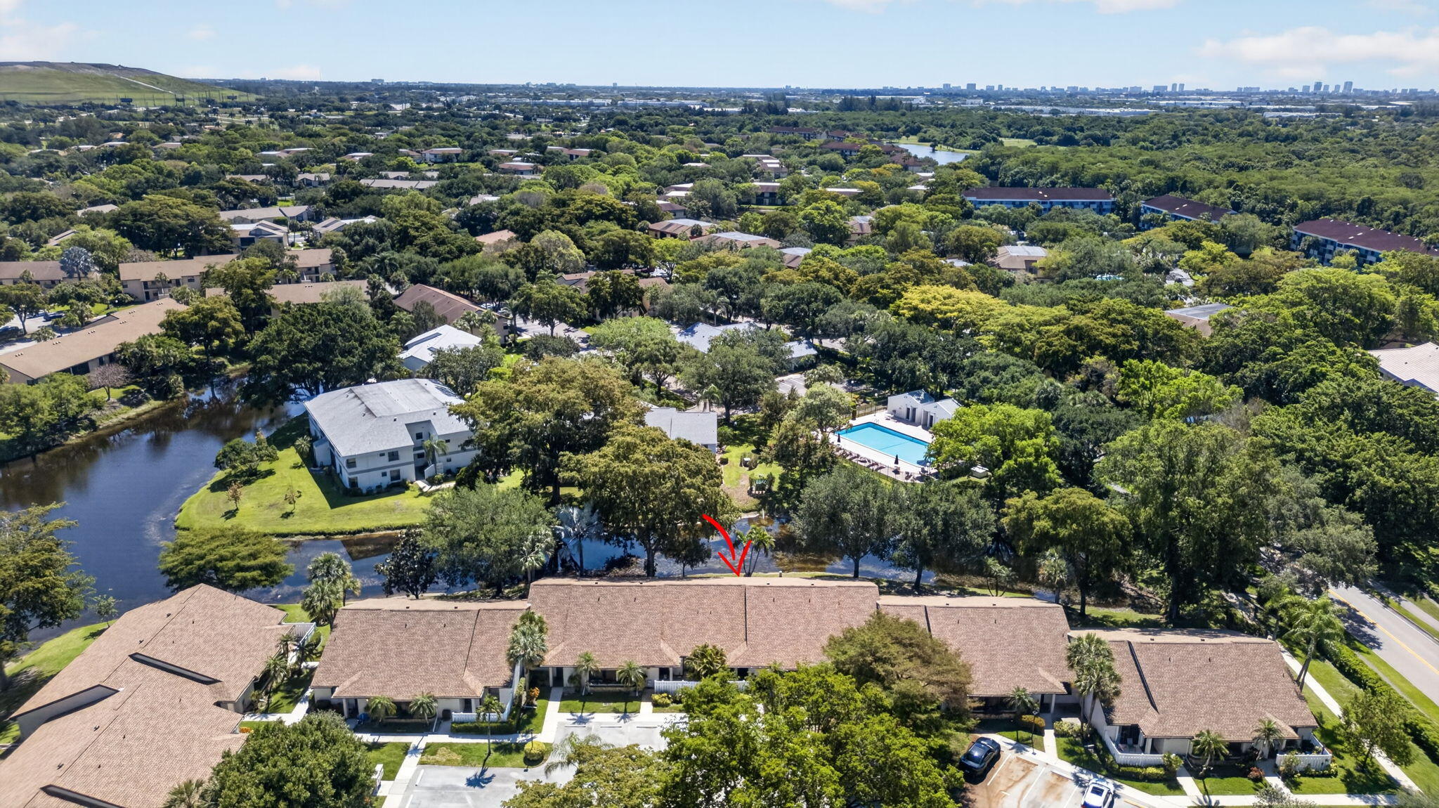 Great opportunity to update and make it your own at a price positioned for a quick sale. Spacious 2/2 villa located in the desirable Ginger Tree community within The Township at Coconut Creek. This single-story unit features vaulted ceilings, tile flooring, a spacious primary bedroom with a large walk-in closet, in-unit washer and dryer, and an enclosed Florida room with peaceful lake and pool views. Recent upgrades include a new roof, A/C approximately 1.5 years old, and a newer water heater. Community amenities include a theater, ballroom, fitness center, tennis courts, aquatic center with Olympic-size pool, indoor racquetball, jogging paths, and much more. Maintenance includes trash, basic cable, lawn care, pest control, and recreational facilities. Per association: 1 pet allowed under 20 lbs. No leasing permitted. Minimum 650 credit score required. 10% down payment required.