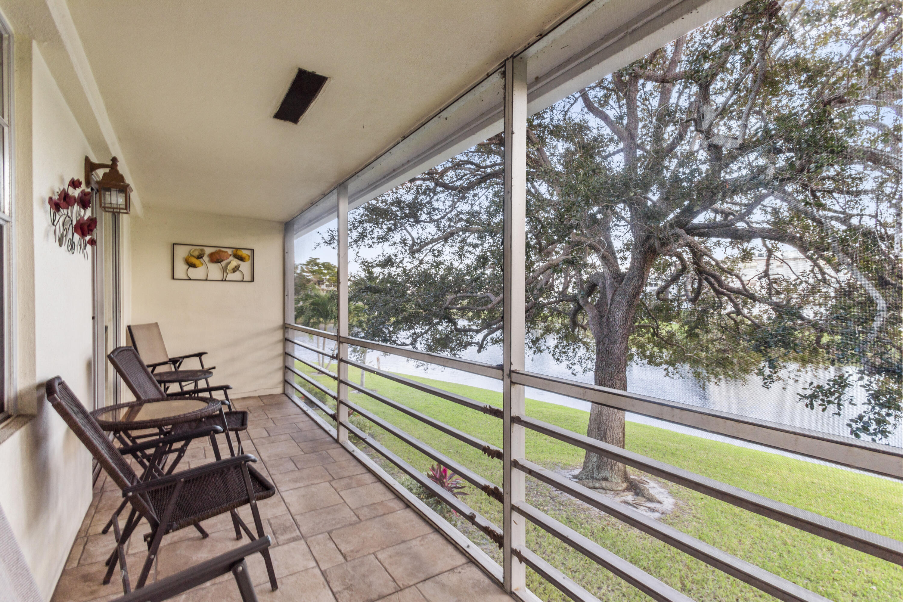 Immaculately kept waterfront condo in the desirable 55+ community of Century Village Deerfield Beach. Enjoy peace of mind with a sound association budget, no assessments, and the lowest HOA dues in the community! This bright and inviting home features a beautiful kitchen and bathrooms, spacious living areas, and a tranquil water view from your private balcony. Century Village offers resort-style amenities including pools, fitness centers, clubhouse, tennis, pickleball, courtesy shuttles, and endless social activities—all in an amazing location close to shopping, dining, and the beach. A perfect combination of quality, value, and lifestyle! NEW ROOF!!!! LOW DUES!!! FREE LAUNDRY!
